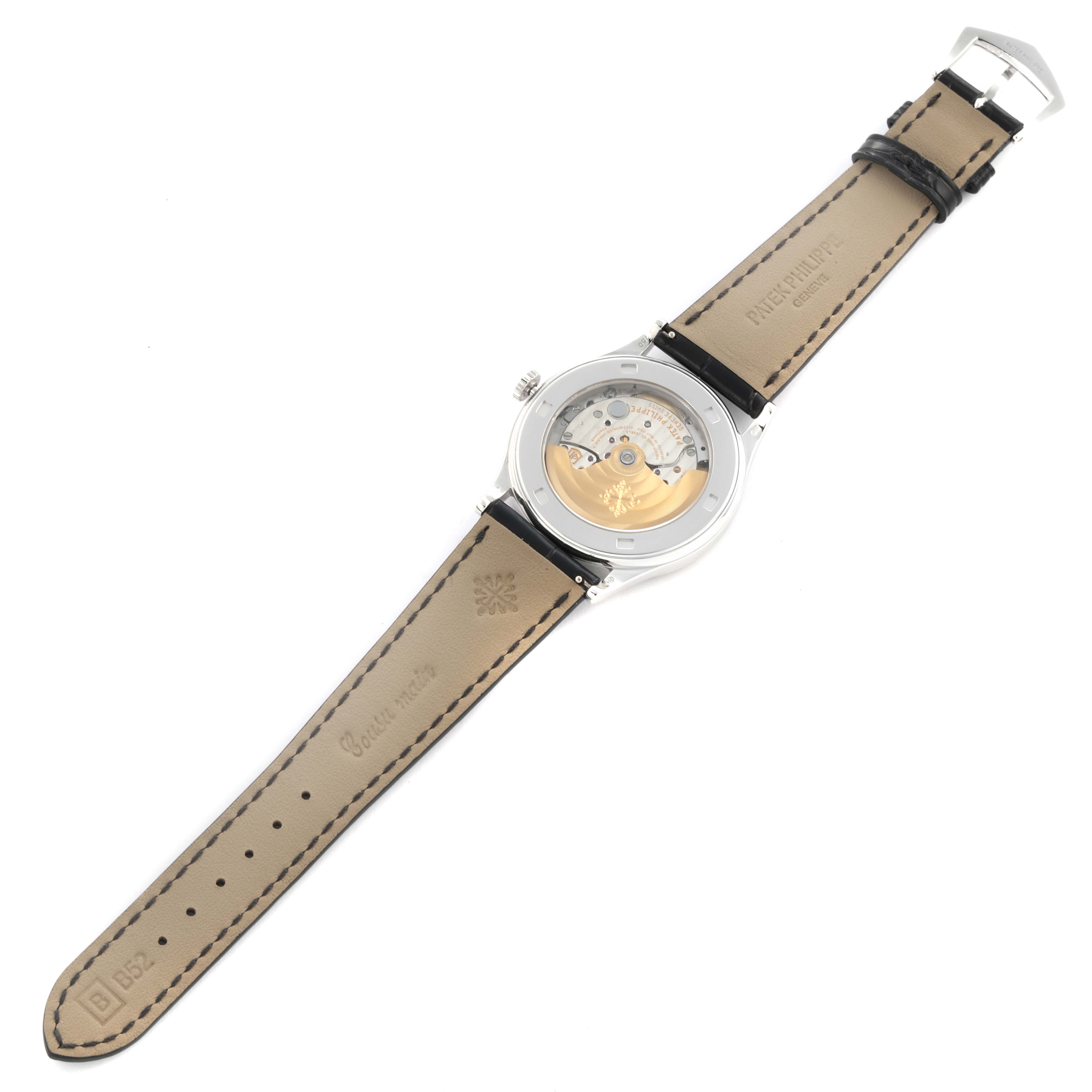 The Patek Philippe Calatrava 5297G-001 Men's White Gold Black Dial 5297G-001 Men's White Gold Black Dial watch is shown from the back, displaying its movement and leather straps.