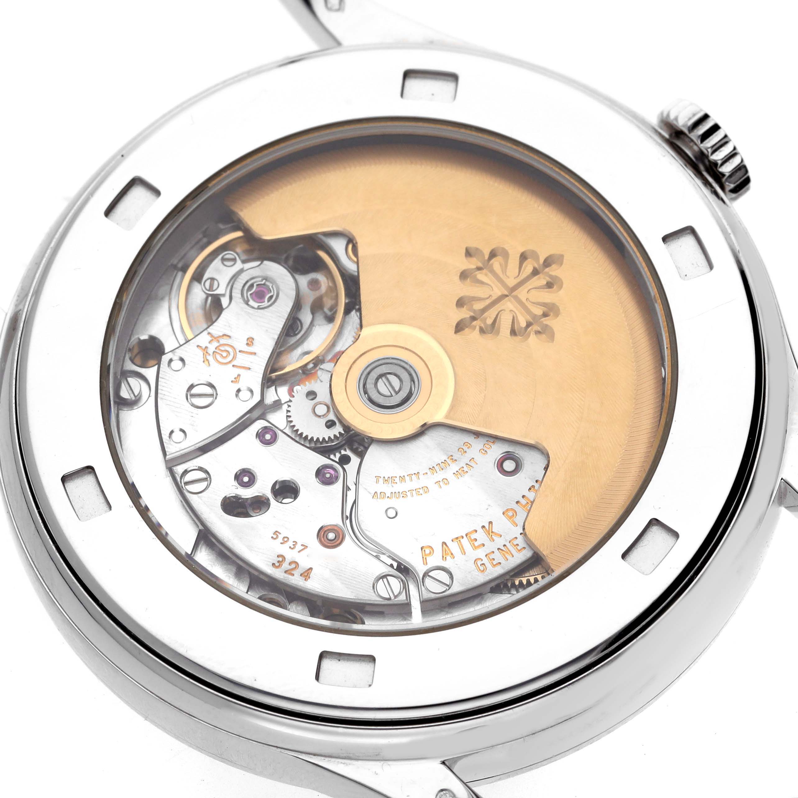 The image shows the back of a Patek Philippe Calatrava 5297G-001 Men's White Gold Black Dial 5297G-001 Men's White Gold Black Dial, highlighting its mechanical movement and rotor.