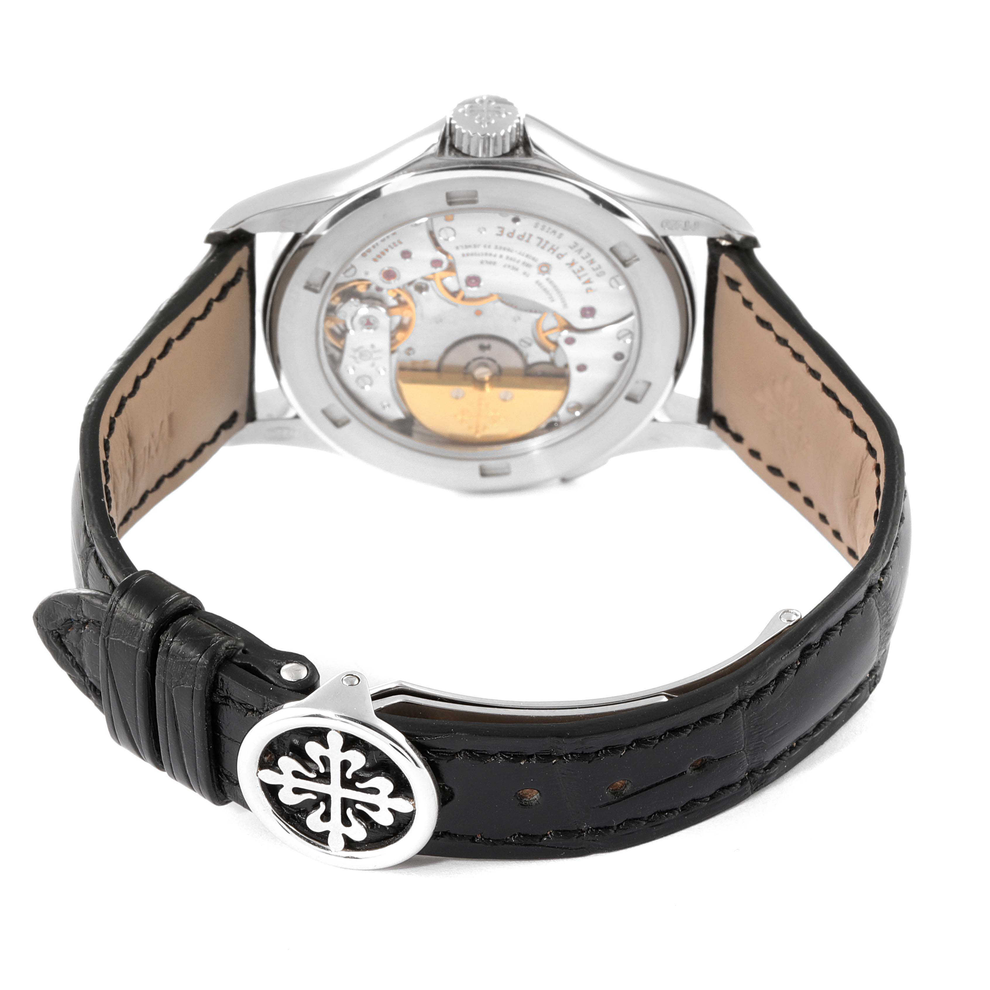 This image shows the rear view of the Patek Philippe Complications 5110P Men's Platinum Silver Dial 5110P Men's Platinum Silver Dial model, highlighting its movement and black leather strap.