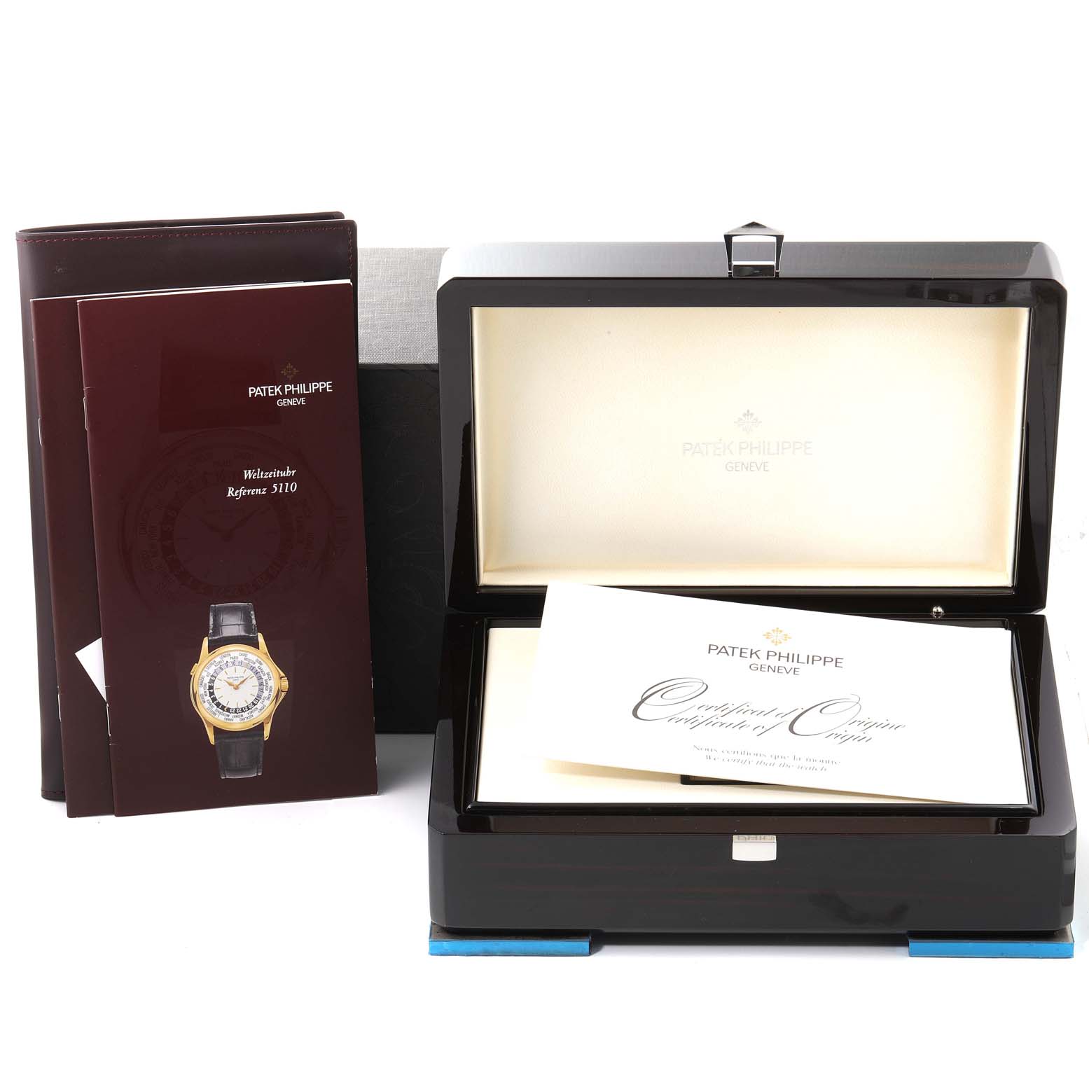 The image shows the packaging and documentation for a Patek Philippe Complications 5110P Men's Platinum Silver Dial 5110P Men's Platinum Silver Dial watch, including the open watch box and certificates.