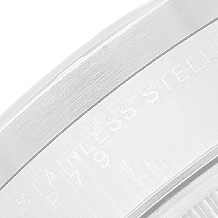 This close-up image shows a portion of the stainless steel case back of a Rolex Air-King 14010 Men's Stainless Steel Blue Dial 14010 Men's Stainless Steel Blue Dial watch.