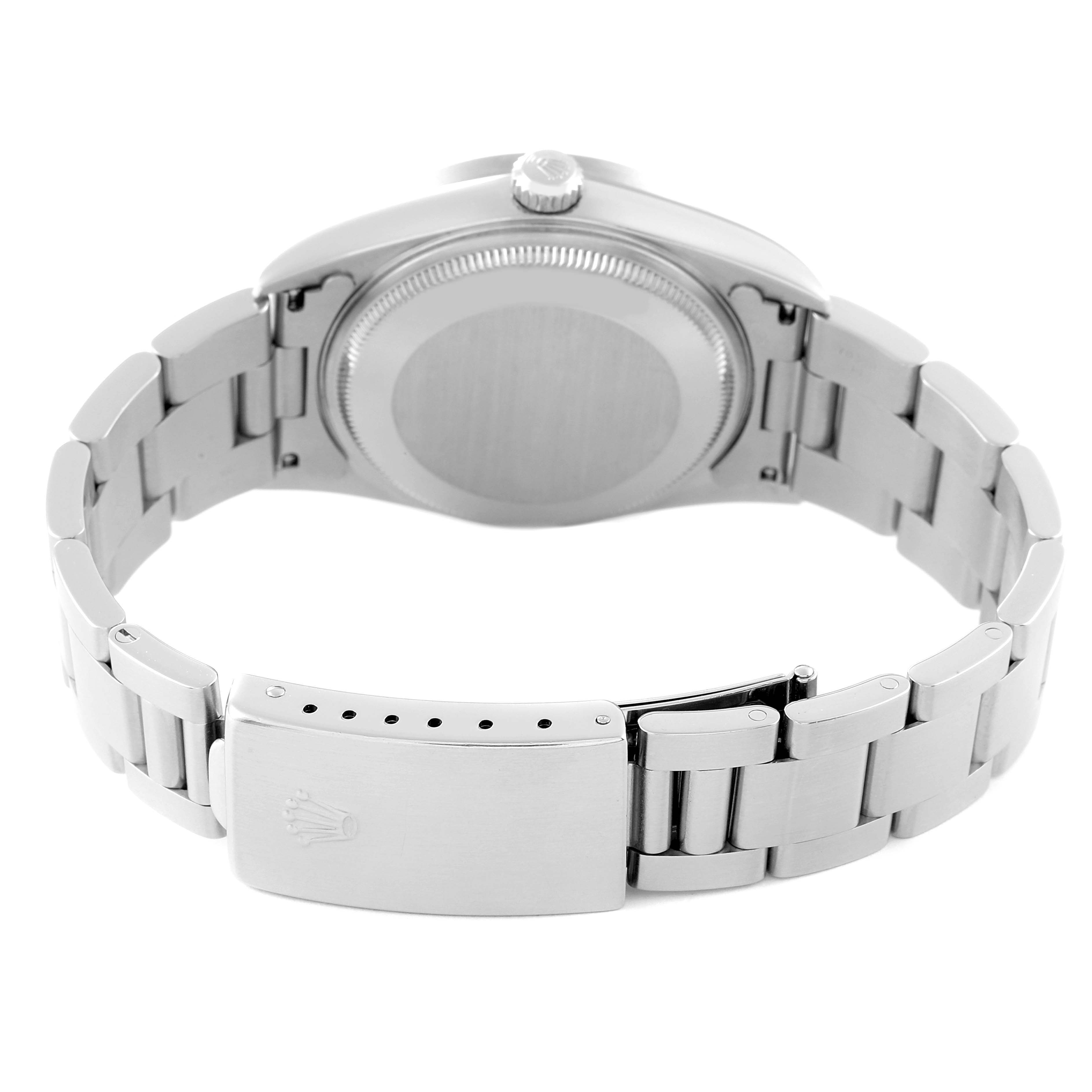 The image shows the back casing and bracelet of a Rolex Air-King 14010 Men's Stainless Steel Blue Dial 14010 Men's Stainless Steel Blue Dial watch at a slight top angle.