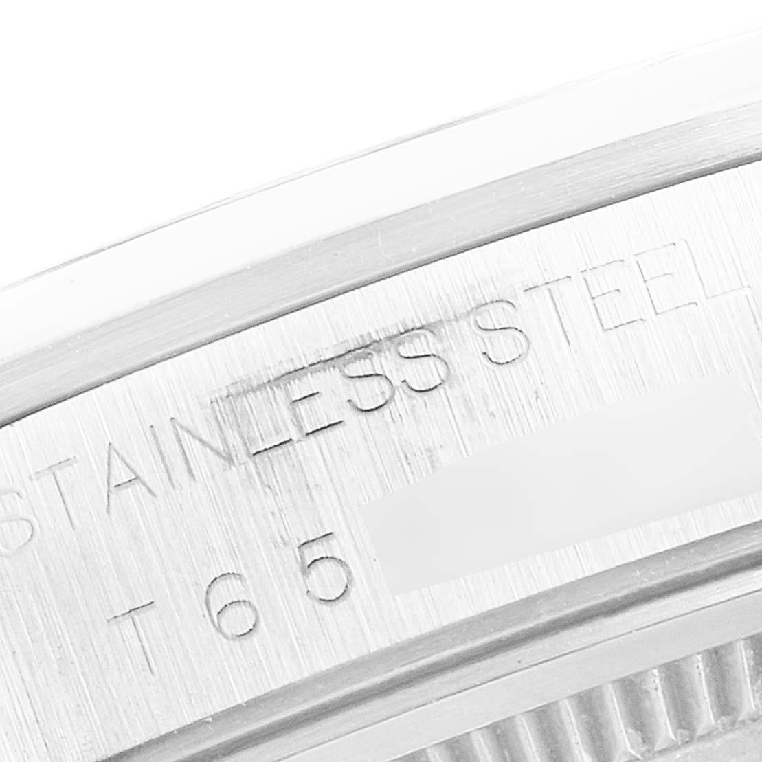 The image shows a close-up of the stainless steel case back of the Rolex Air-King 14000 Men's Stainless Steel White Dial 14000 Men's Stainless Steel White Dial watch, highlighting the engraved text.