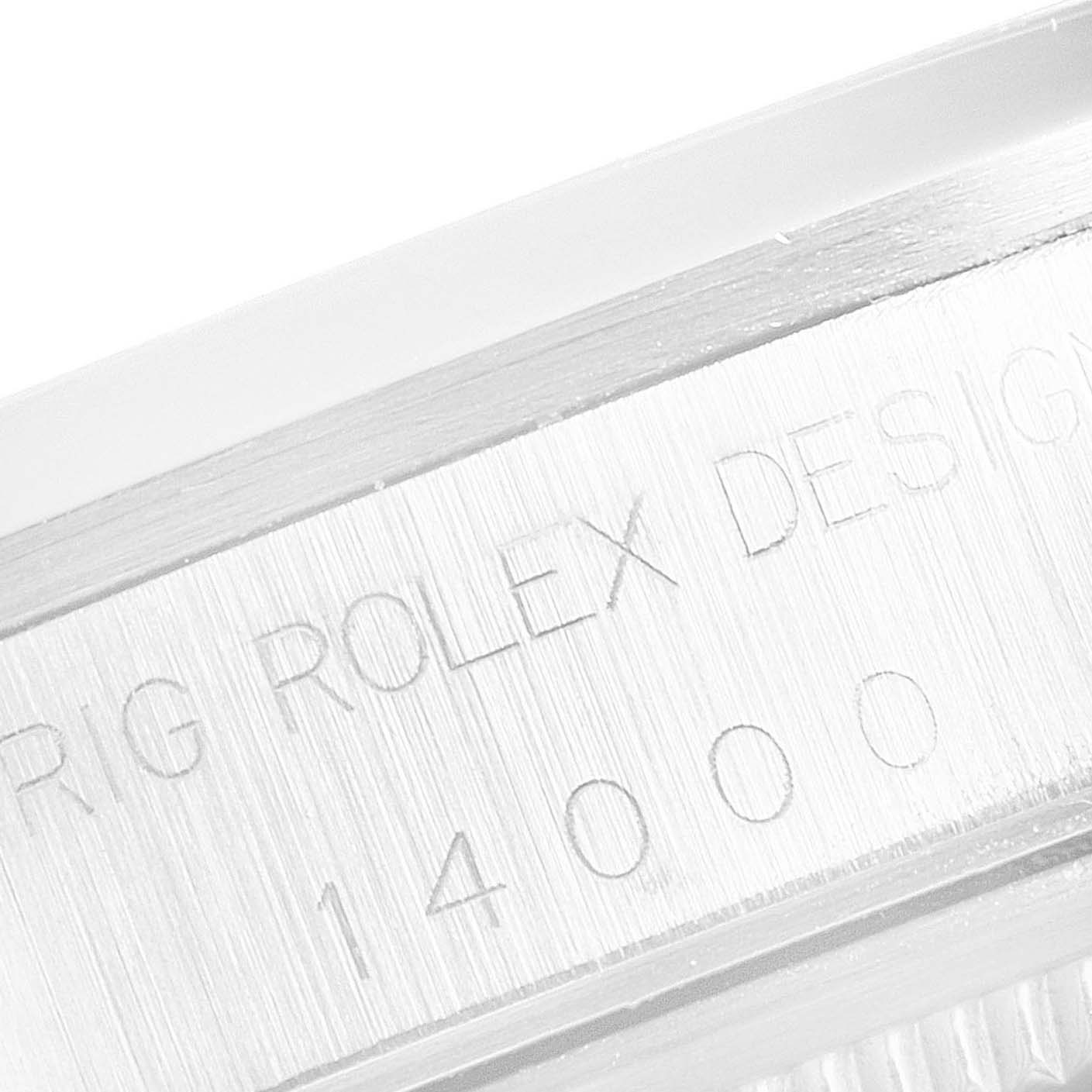 Close-up of the side of a Rolex Air-King 14000 Men's Stainless Steel White Dial 14000 Men's Stainless Steel White Dial watch, showing engraved text and part of the model number.