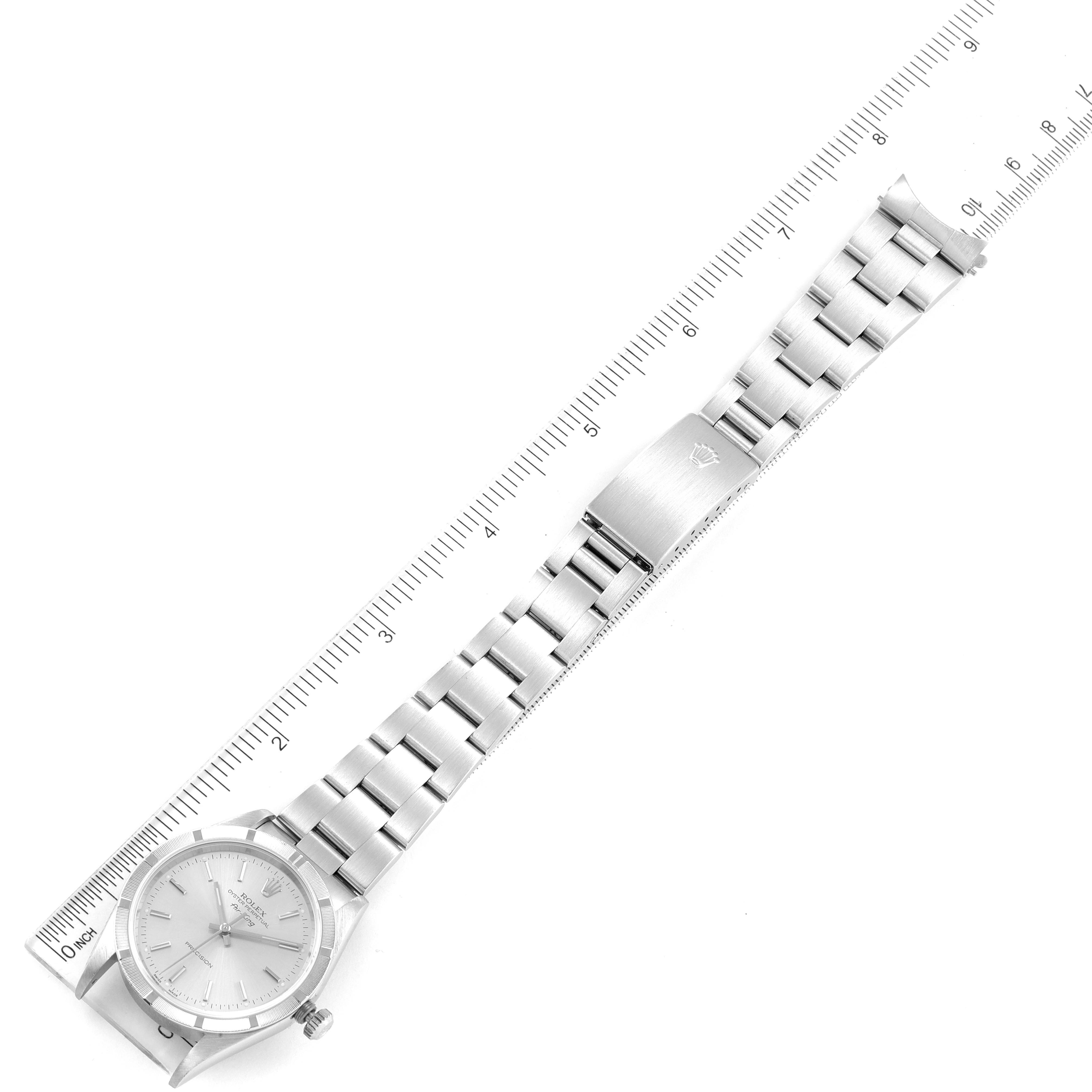 This image shows the Rolex Air-King 14010 Men's Stainless Steel Silver Dial 14010 Men's Stainless Steel Silver Dial watch laid flat with its dial, bracelet, and clasp visible, alongside a measuring ruler.