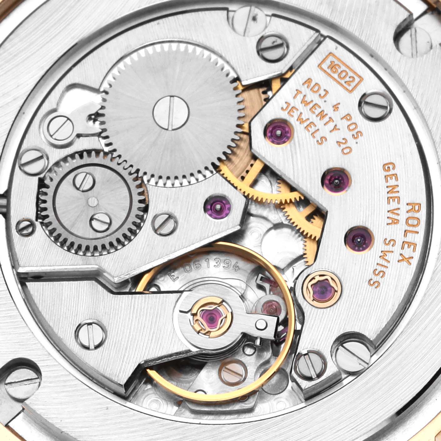 The image shows the intricate movement and gears of a Rolex Cellini 5115/8 Men's Yellow Gold White Dial 5115/8 Men's Yellow Gold White Dial watch, viewed from the back.