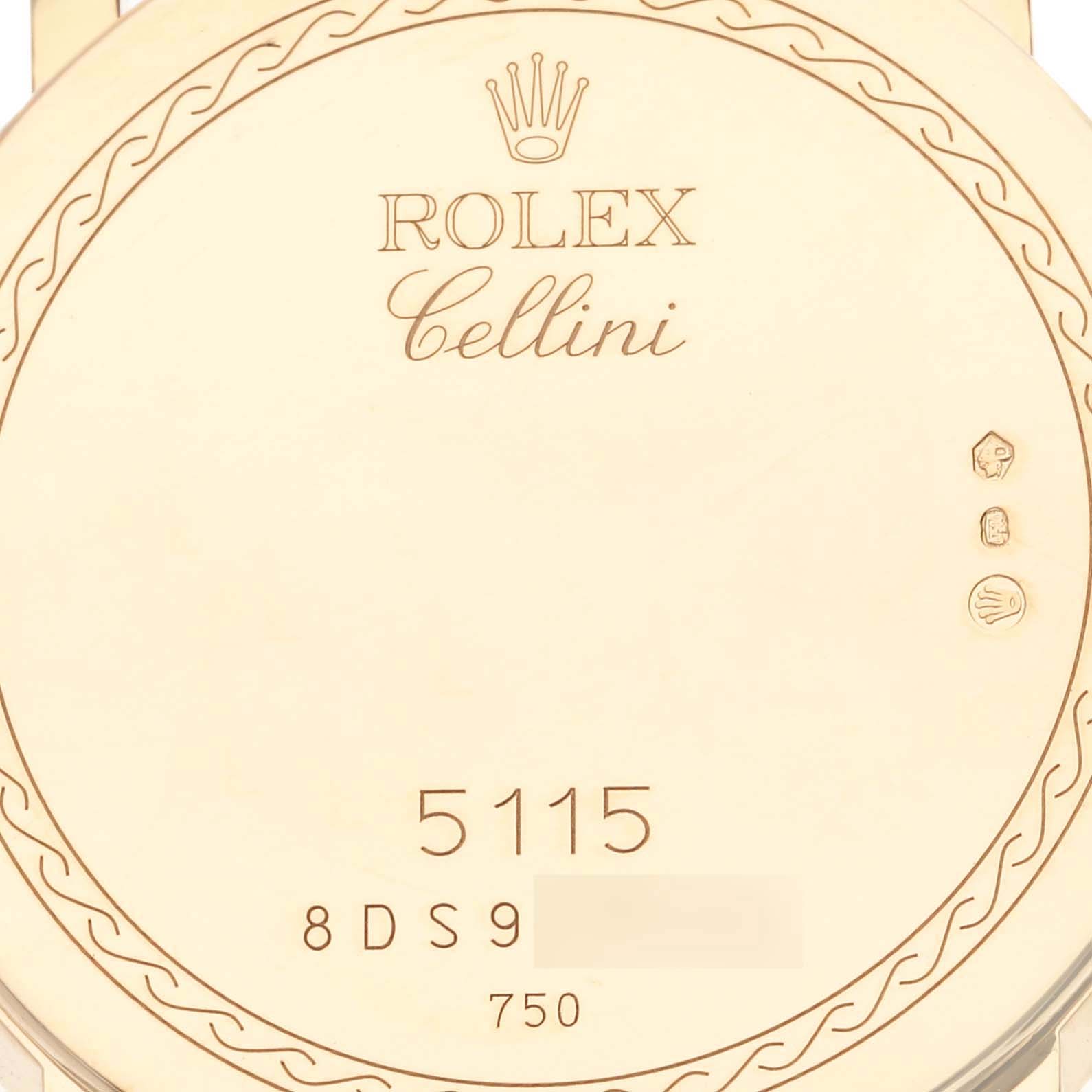This image shows the backside of the Rolex Cellini 5115/8 Men's Yellow Gold White Dial 5115/8 Men's Yellow Gold White Dial watch, featuring engravings including the model number and hallmarks.