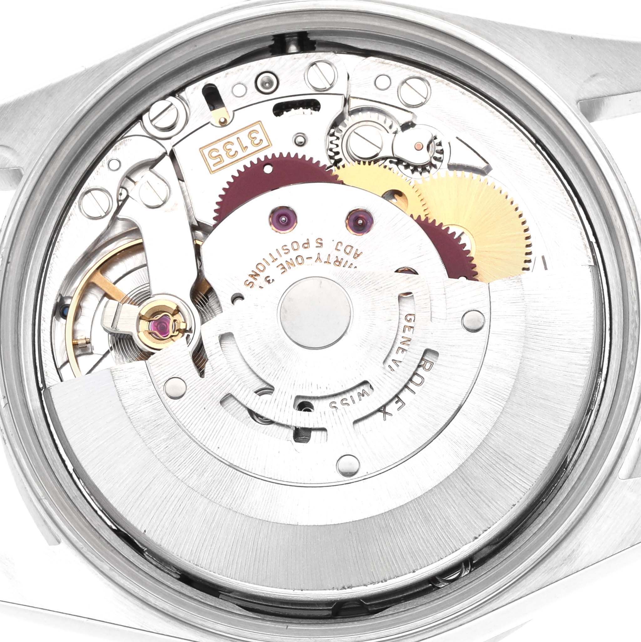 The image shows the internal mechanism of a Rolex Date 15210 Men's Stainless Steel Blue Dial watch, highlighting gears and the balance wheel from a top-down angle.