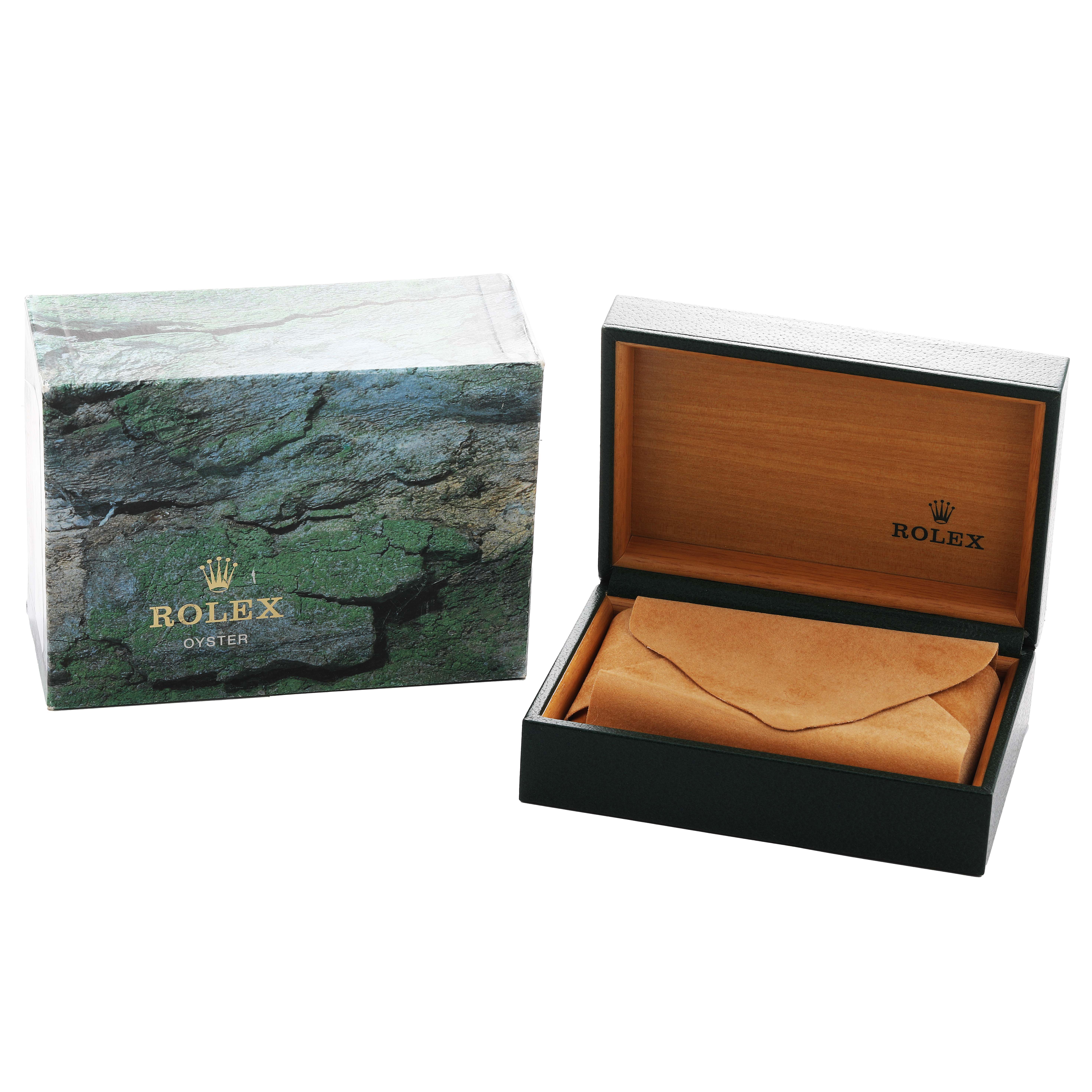 The image shows Rolex Date 15200 Men's Stainless Steel Blue Dial packaging with an open box and outer sleeve, showcasing the luxurious presentation.