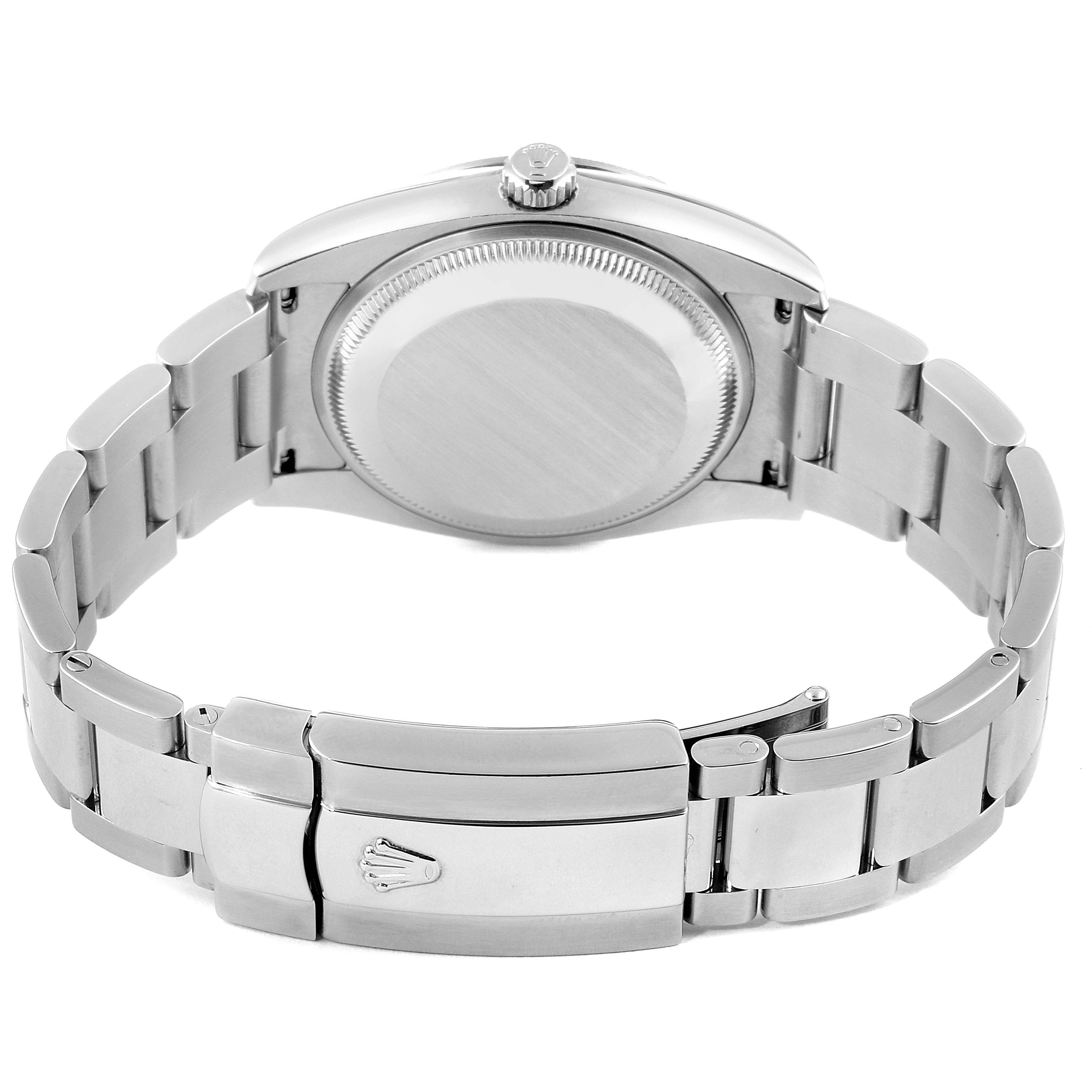 The Rolex Date 115210 Men's Stainless Steel Blue Dial 115210 Men's Stainless Steel Blue Dial model watch is shown from the back, highlighting the case back, crown, and bracelet with the clasp.