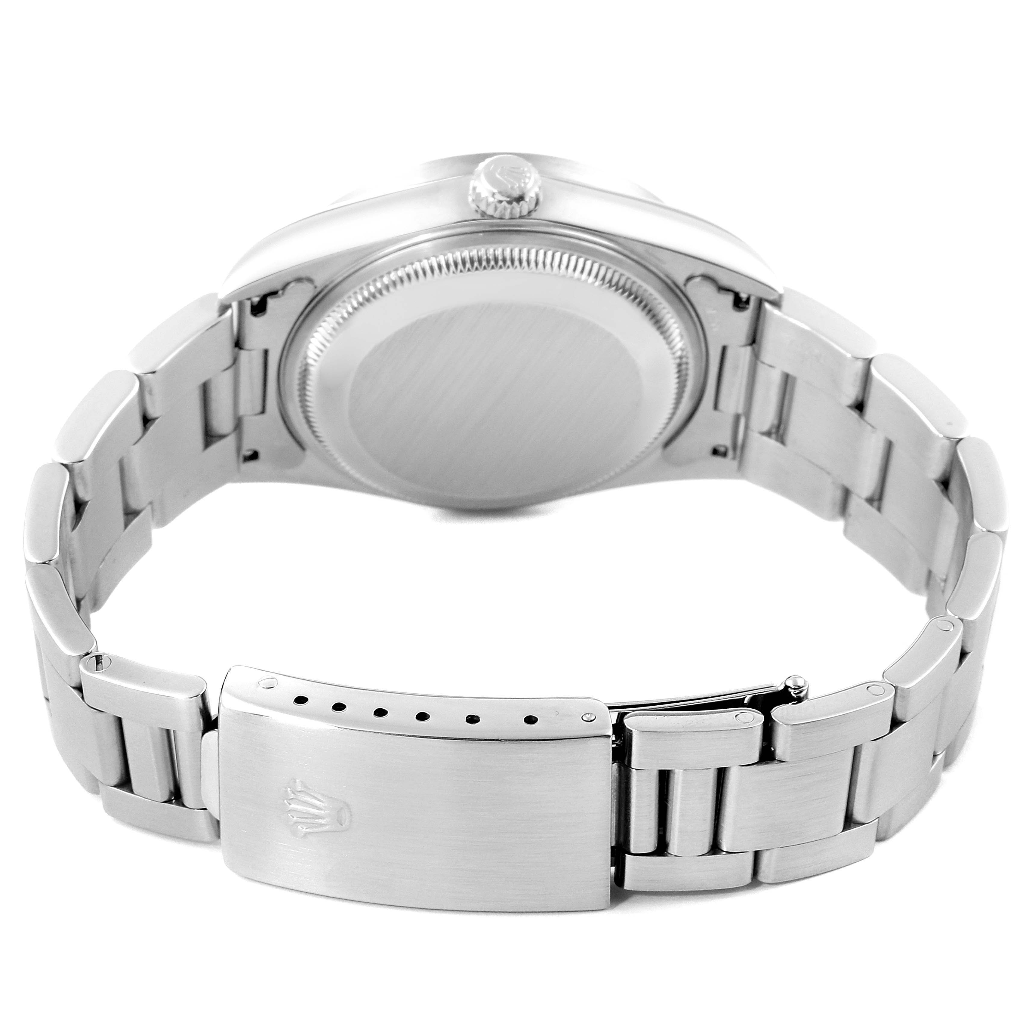 This image shows the back of a Rolex Date 15210 Men's Stainless Steel White Dial 15210 Men's Stainless Steel White Dial model watch, highlighting the case back and stainless steel bracelet with clasp.