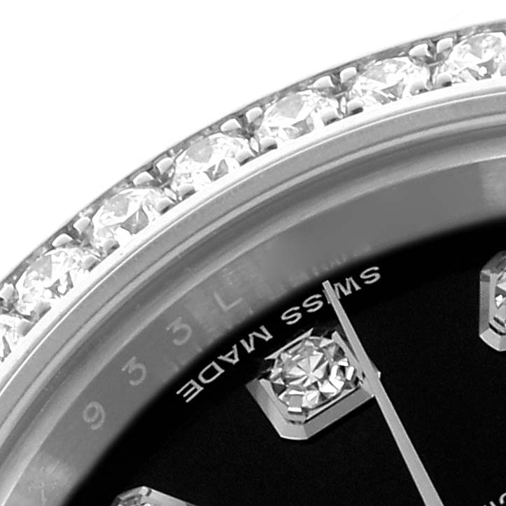 The image shows a close-up of the bezel and dial of a Rolex Datejust 179384 Women's Stainless Steel Black Dial 179384 Women's Stainless Steel Black Dial with diamond detailing.