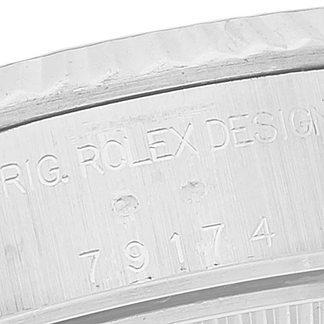 This is a close-up image of the etched model number and Rolex branding on the inner bezel of a Rolex Datejust 79174 Women's Stainless Steel Black Dial 79174 Women's Stainless Steel Black Dial watch.