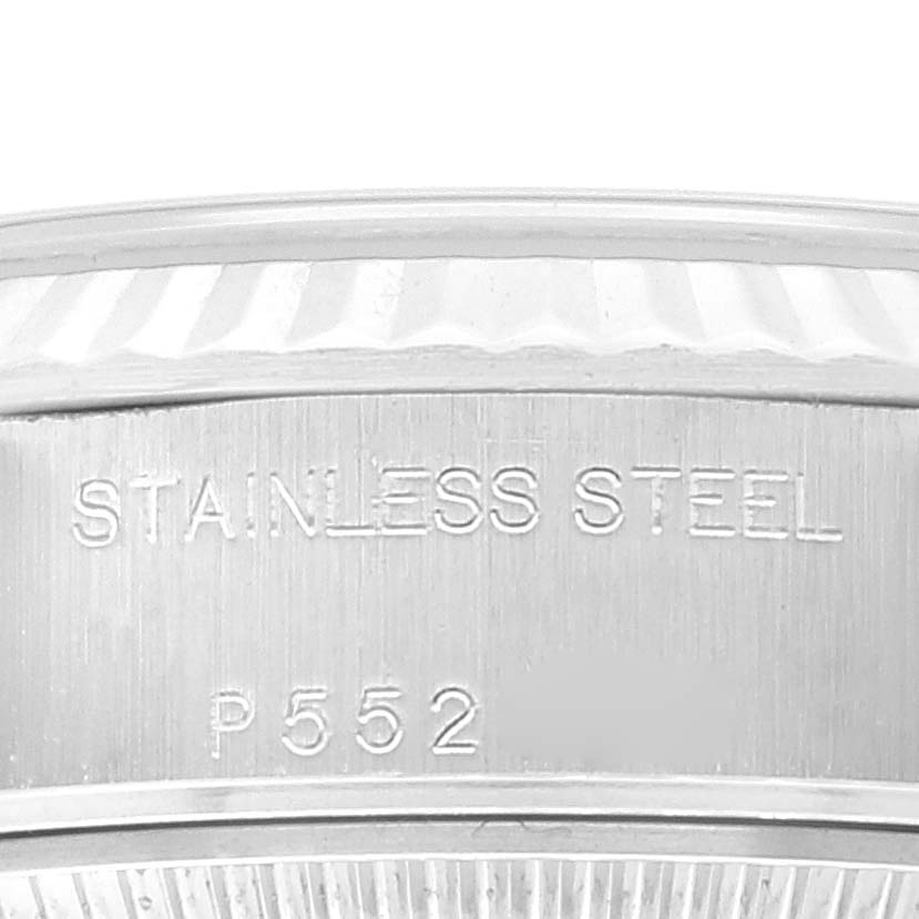 This image shows a close-up of the stainless steel case back of a Rolex Datejust 79174 Women's Stainless Steel Silver Dial 79174 Women's Stainless Steel Silver Dial model, featuring engraving details.
