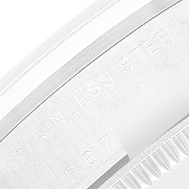 This is a close-up view of the caseback of a Rolex Mid-Size 78240 Women
s Stainless Steel Black Dial 78240 Women
s Stainless Steel Black Dial model, highlighting the "STAINLESS STEEL" engraving.