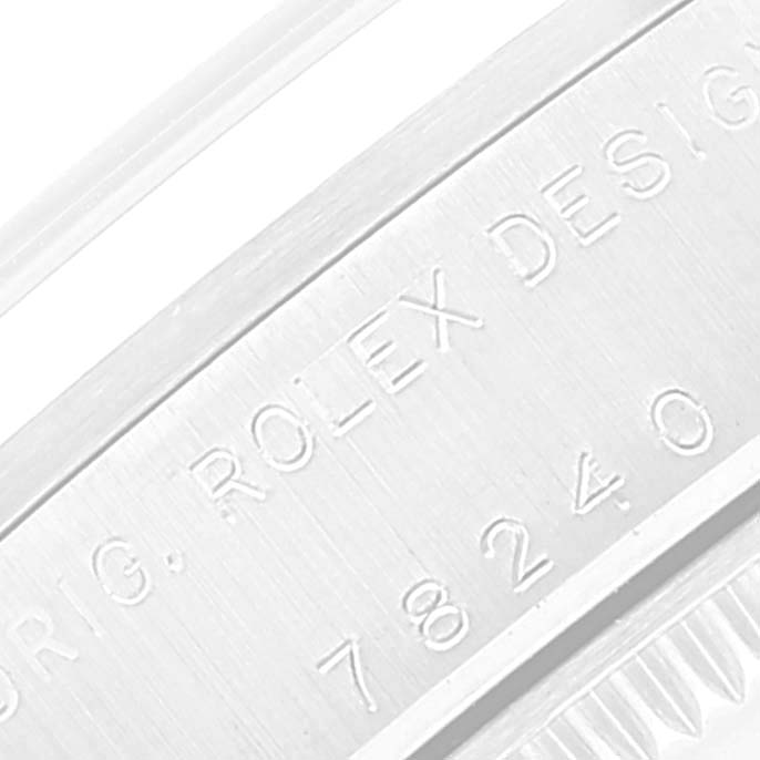 The image shows a close-up of the engraved side of a Rolex Mid-Size 78240 Women
s Stainless Steel Black Dial 78240 Women
s Stainless Steel Black Dial model watch case.