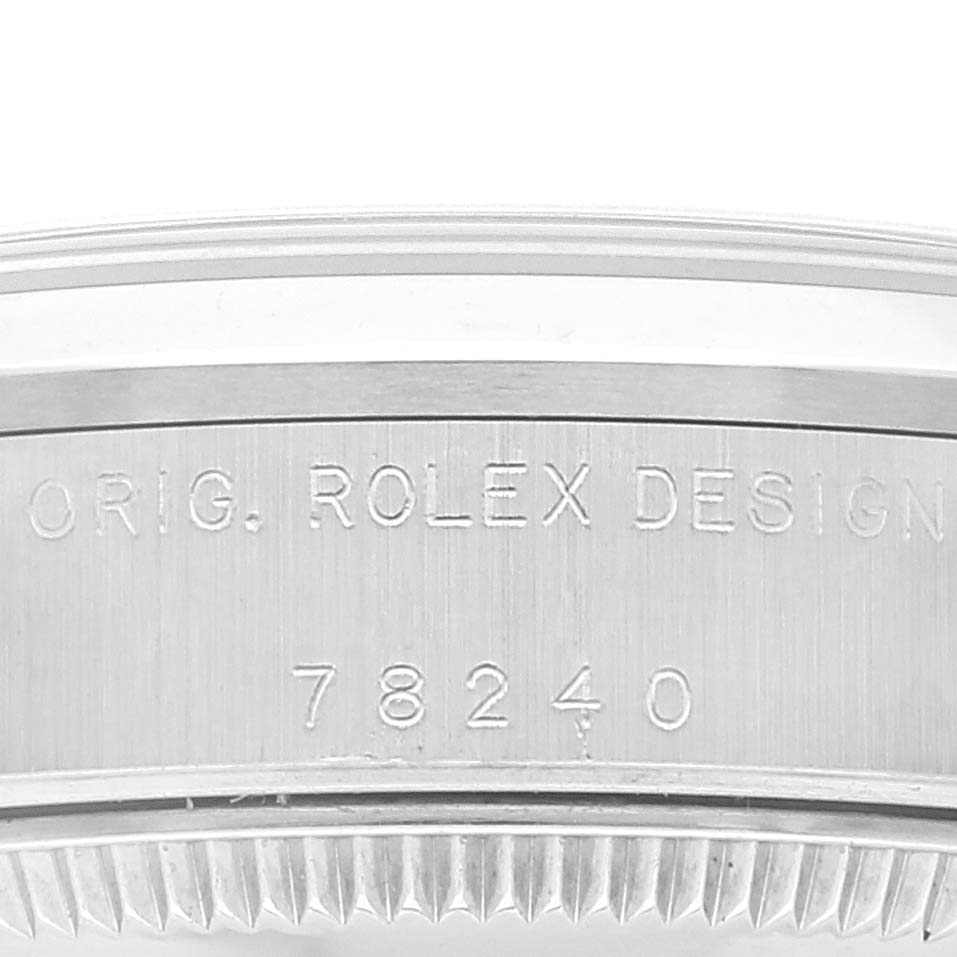 The image shows the model number and design engraving on the side of a Rolex Mid-Size 78240 Women
s Stainless Steel Blue Dial 78240 Women
s Stainless Steel Blue Dial watch case, model number 78240.