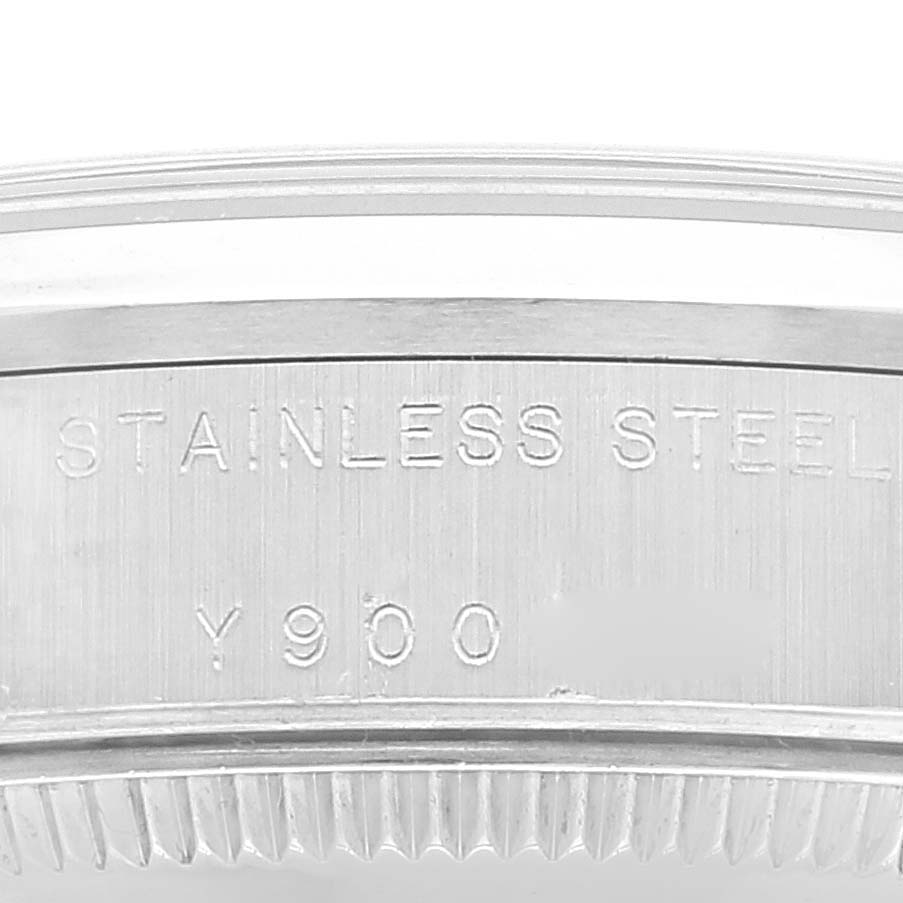 This image shows a close-up of the stainless steel case back engraving on a Mid-Size Rolex watch.