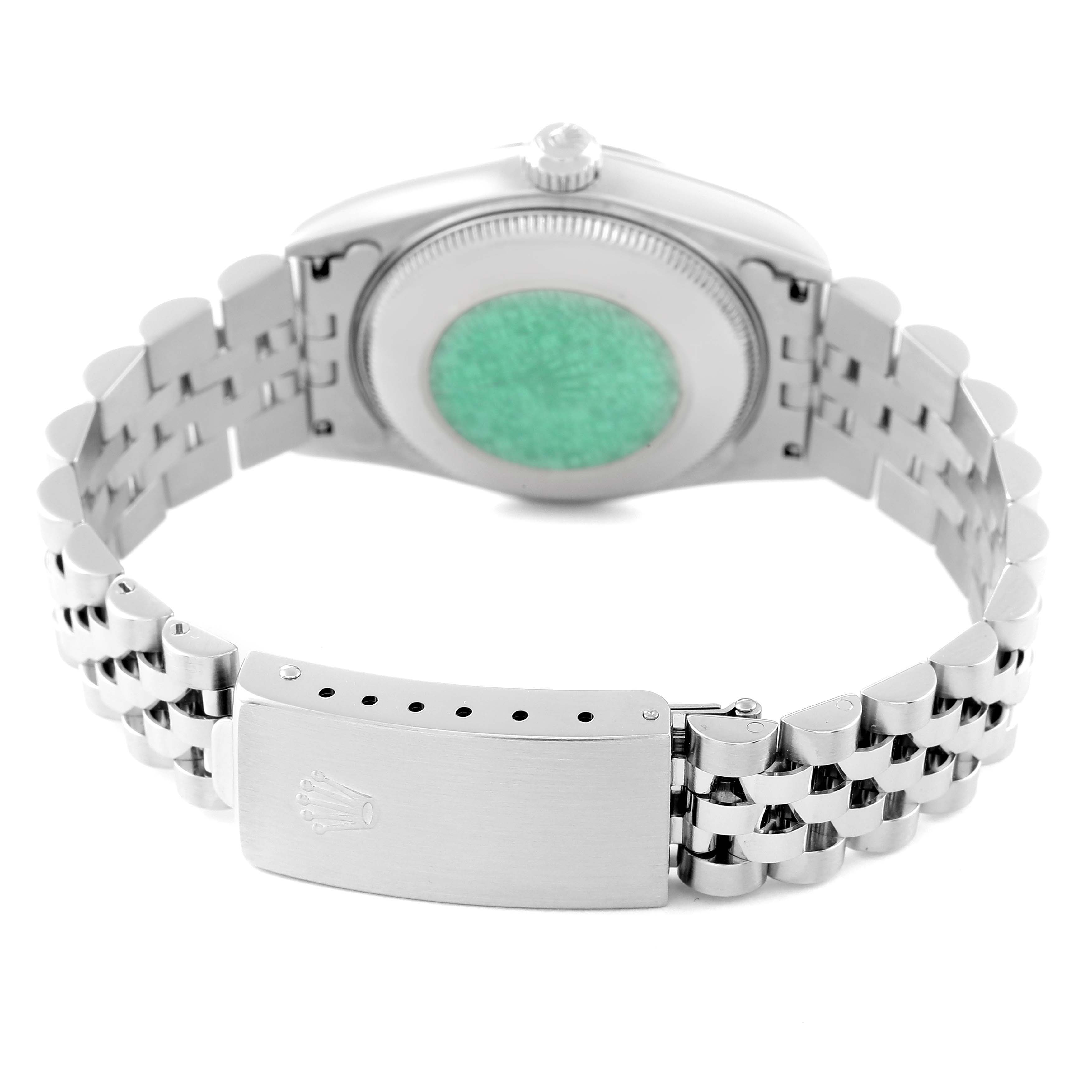 The image shows the back view of a Mid-Size Rolex watch, focusing on the case back, crown, and bracelet.