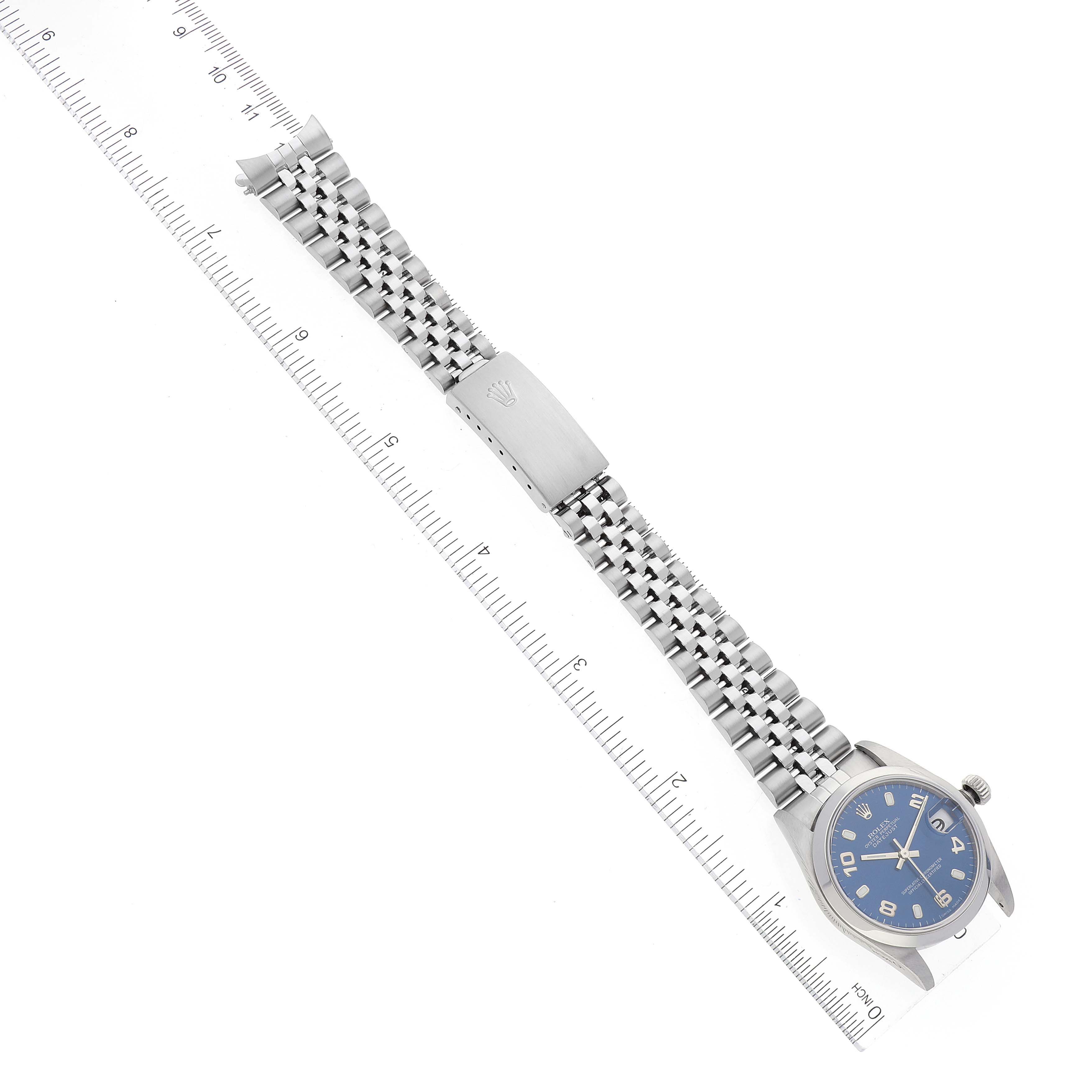 The image shows a laid-flat overhead view of a Rolex Mid-Size 78240 Women
s Stainless Steel Blue Dial 78240 Women
s Stainless Steel Blue Dial watch with a blue dial, stainless steel bracelet, and clasp.