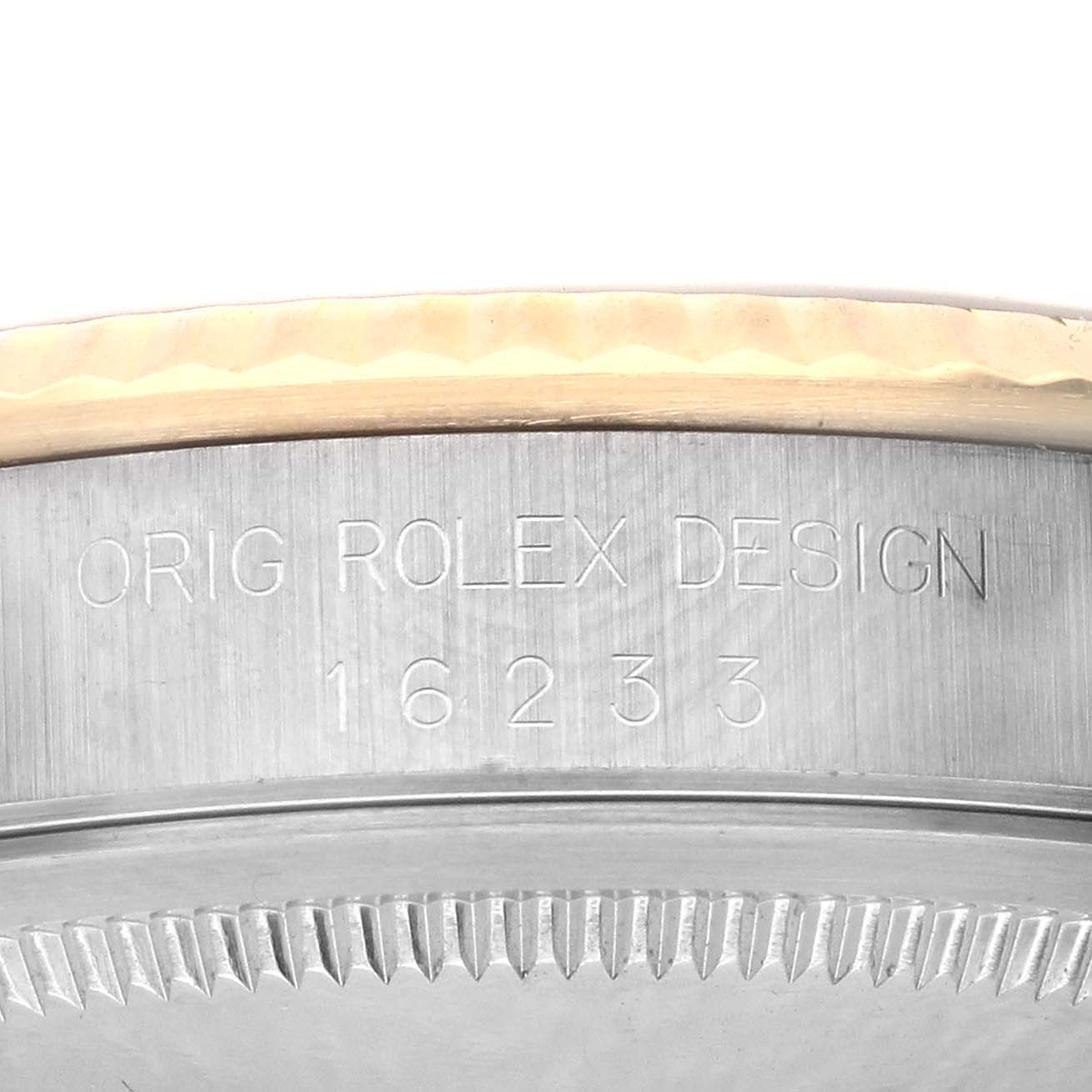 The image shows the side of a Rolex Datejust 16233 Men's Steel and Gold (two tone) Black Dial 16233 Men's Steel and Gold (two tone) Black Dial case, featuring the engraved model number and "Orig Rolex Design."