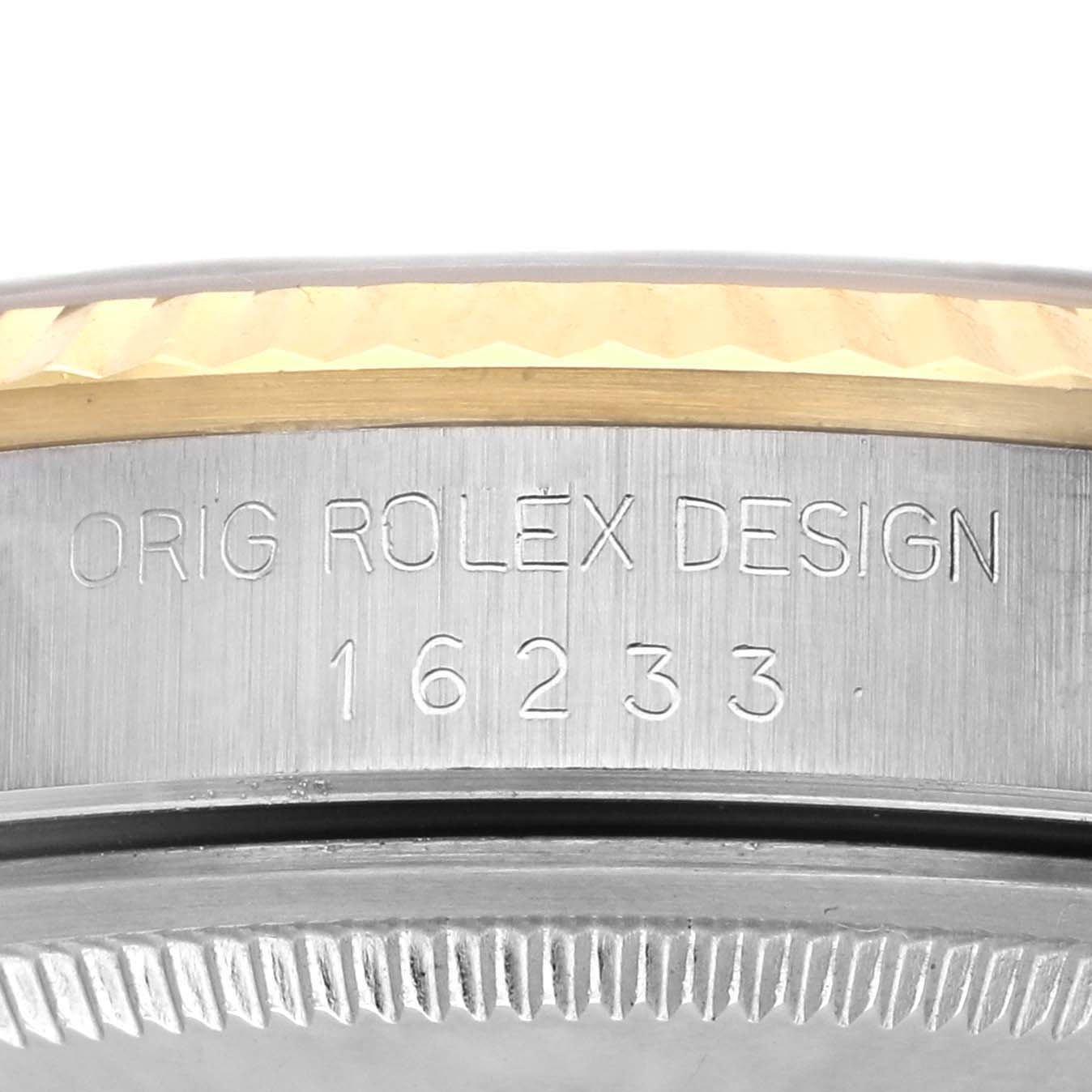 The image shows a close-up of the Rolex Datejust 16233 Men's Steel and Gold (two tone) Champagne Dial 16233 Men's Steel and Gold (two tone) Champagne Dial model's case edge with the engraved model number 16233.