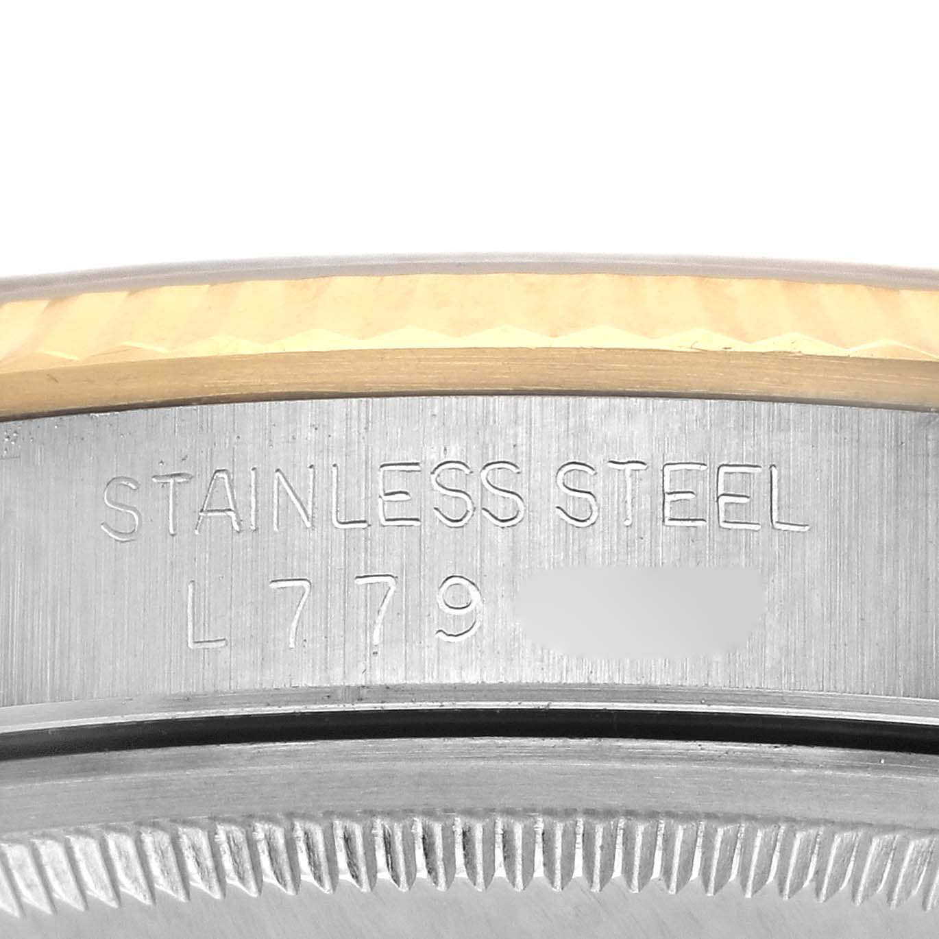 The image shows a side angle of the Rolex Datejust 16233 Men's Steel and Gold (two tone) Champagne Dial 16233 Men's Steel and Gold (two tone) Champagne Dial with the stainless steel engraving and partial view of the bezel.