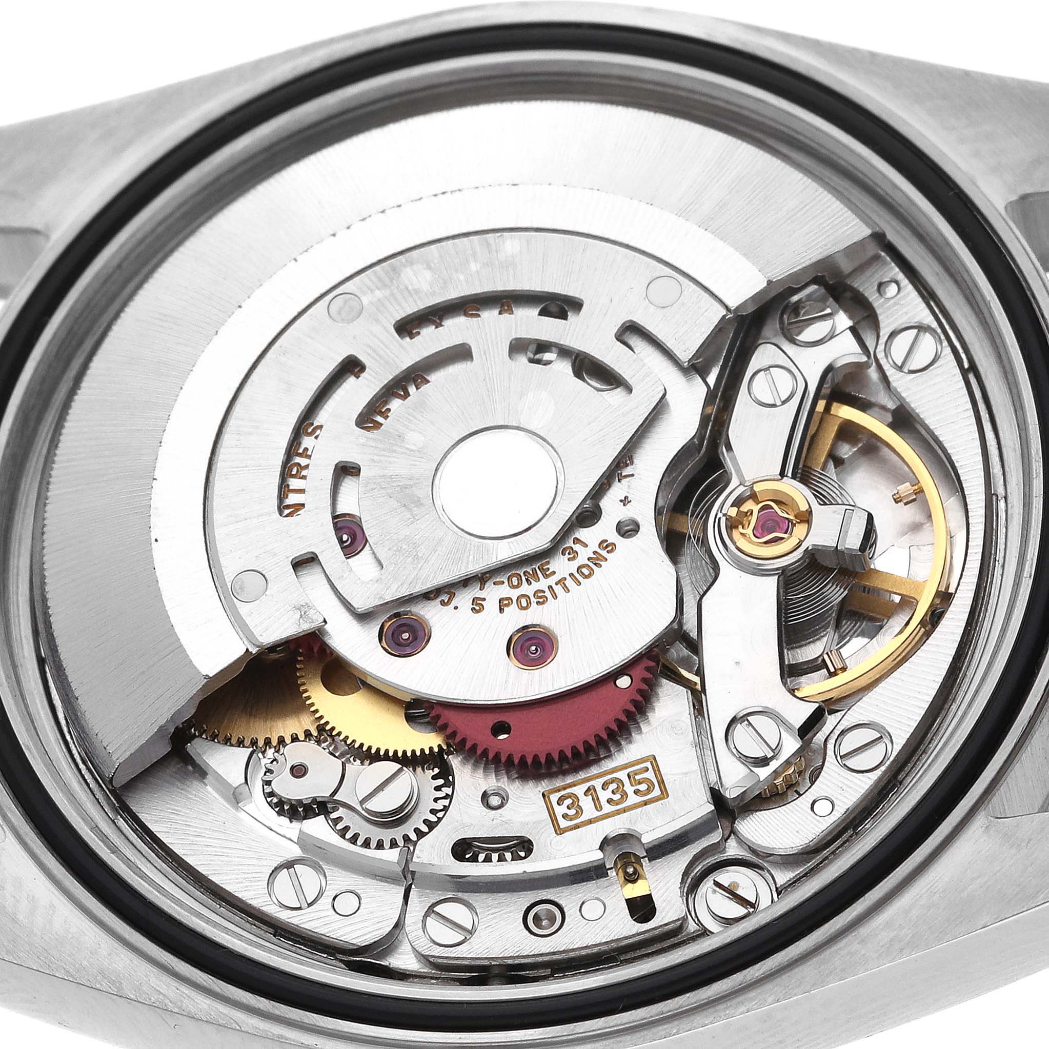 The image shows the internal movement of a Rolex Datejust 16233 Men
s Steel and Gold (two tone) Silver Dial 16233 Men
s Steel and Gold (two tone) Silver Dial watch from a top-down angle, revealing its intricate mechanics.