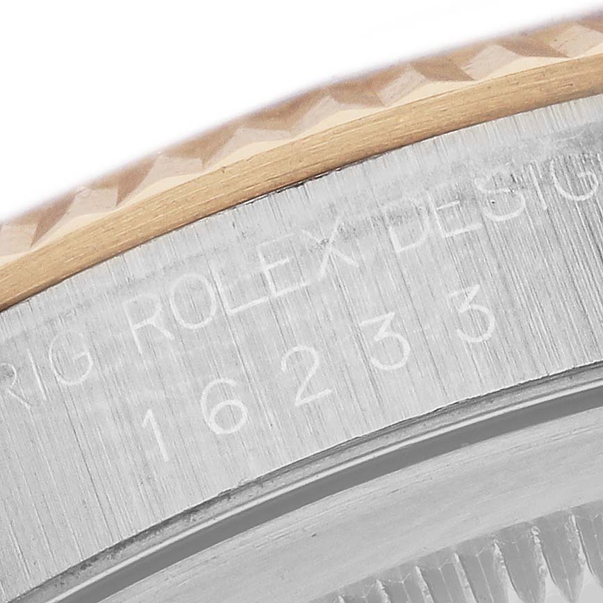 The image shows a close-up of the brushed metal side and engraved model number of a Rolex Datejust 16233 Men
s Steel and Gold (two tone) Silver Dial 16233 Men
s Steel and Gold (two tone) Silver Dial watch, focusing on the bezel area.