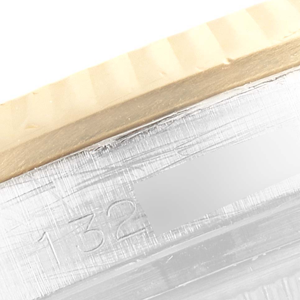 This close-up image of the Rolex Vintage Collection 1603 Men
s Steel and Gold (two tone) Champagne Dial 1603 Men
s Steel and Gold (two tone) Champagne Dial model shows the watch case with part of the engraved serial number.
