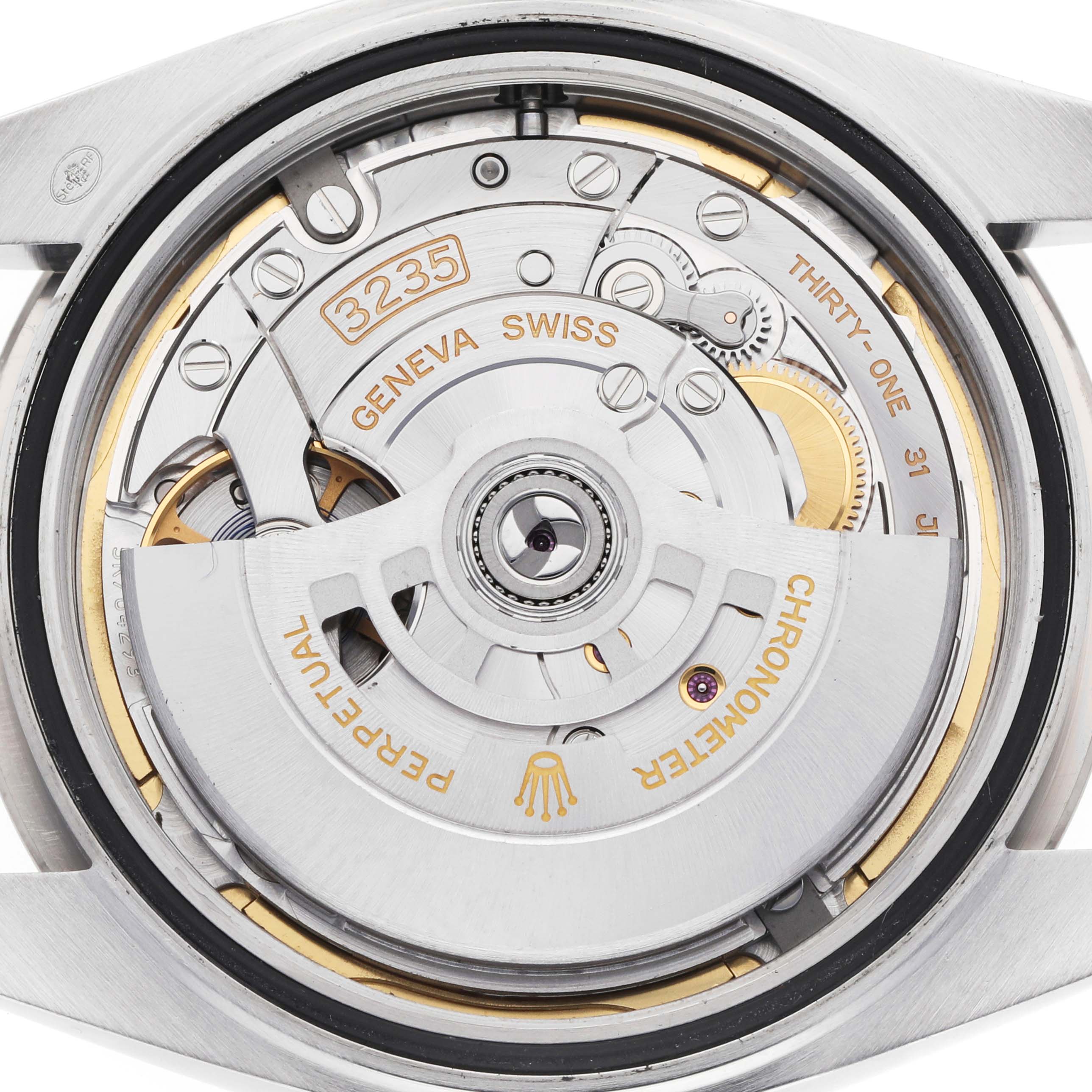 The image shows the Rolex Datejust 41 126334 Men's Stainless Steel Blue Dial's movement, featuring details of the automatic rotor and internal mechanisms.