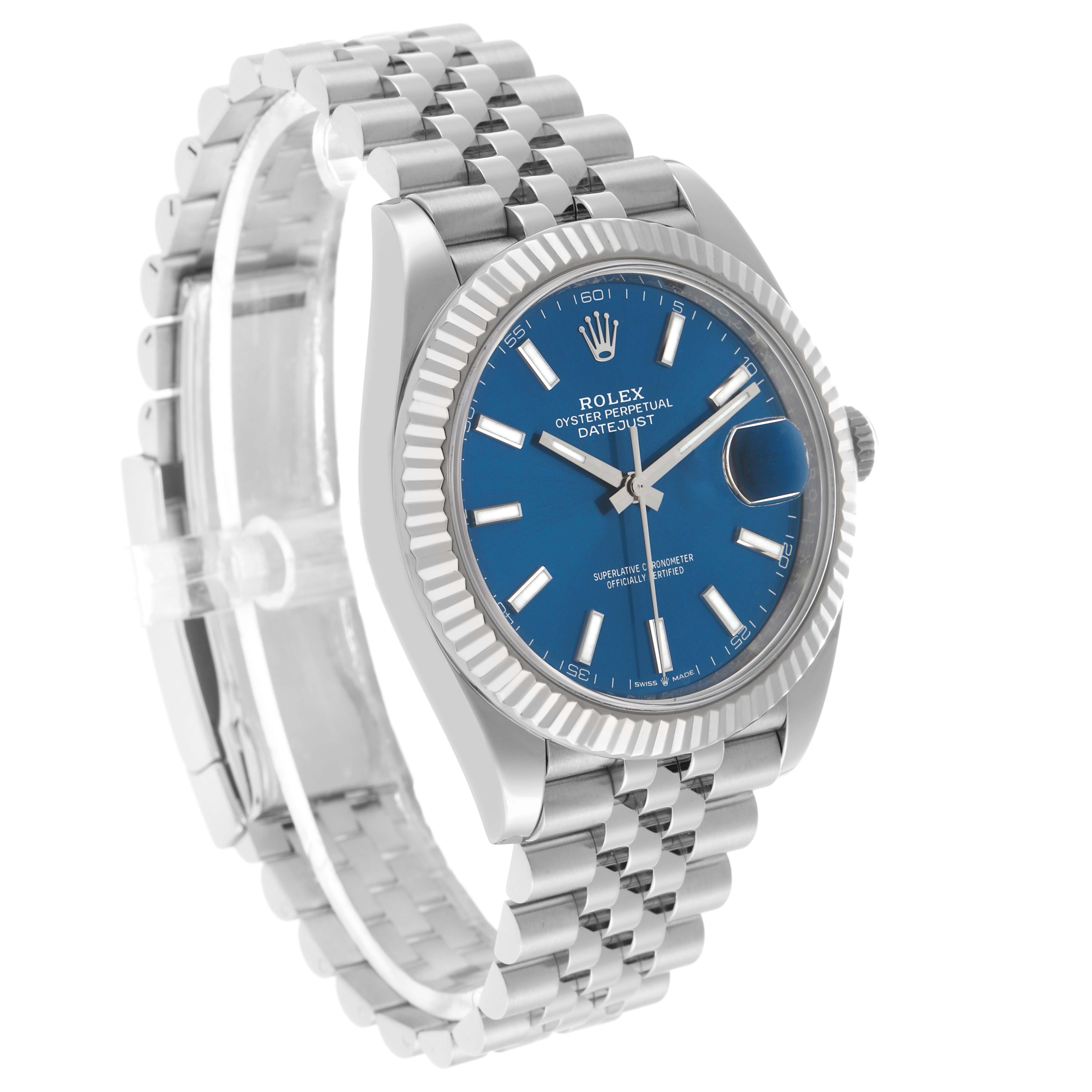 The Rolex Datejust 41 126334 Men's Stainless Steel Blue Dial is shown at a three-quarter angle, highlighting the blue dial, fluted bezel, and Jubilee bracelet.