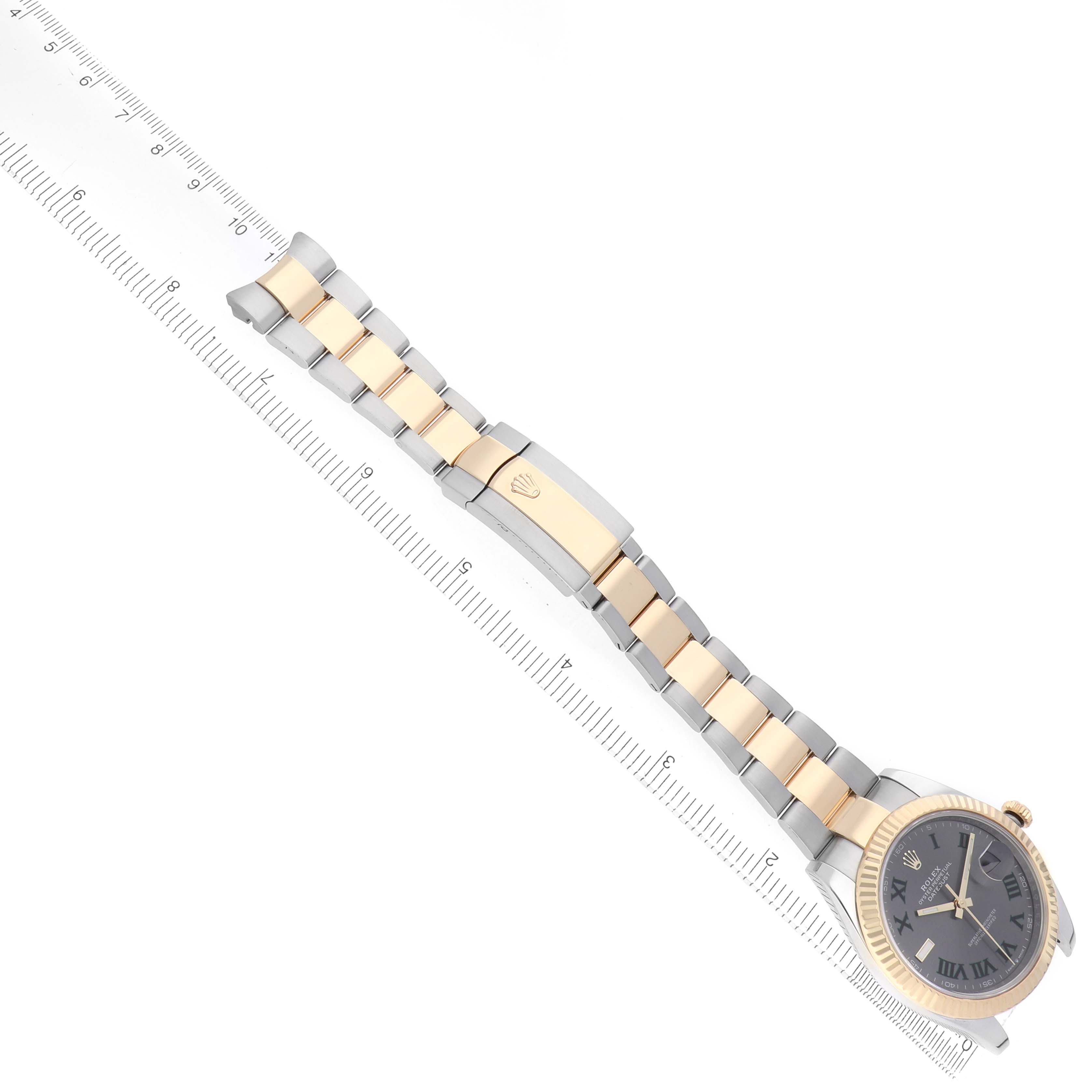 The image shows a Rolex Datejust 41 126333 Men's Steel and Gold (two tone) Grey Dial laid flat, displaying the face, bracelet, and clasp against a ruler for scale.
