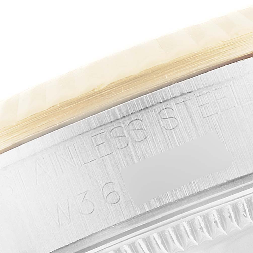 This image shows a close-up of the serial number engraving on the stainless steel case of a Rolex Mid-Size 68273 Women's Steel and Gold (two tone) Silver Dial 68273 Women's Steel and Gold (two tone) Silver Dial model watch.