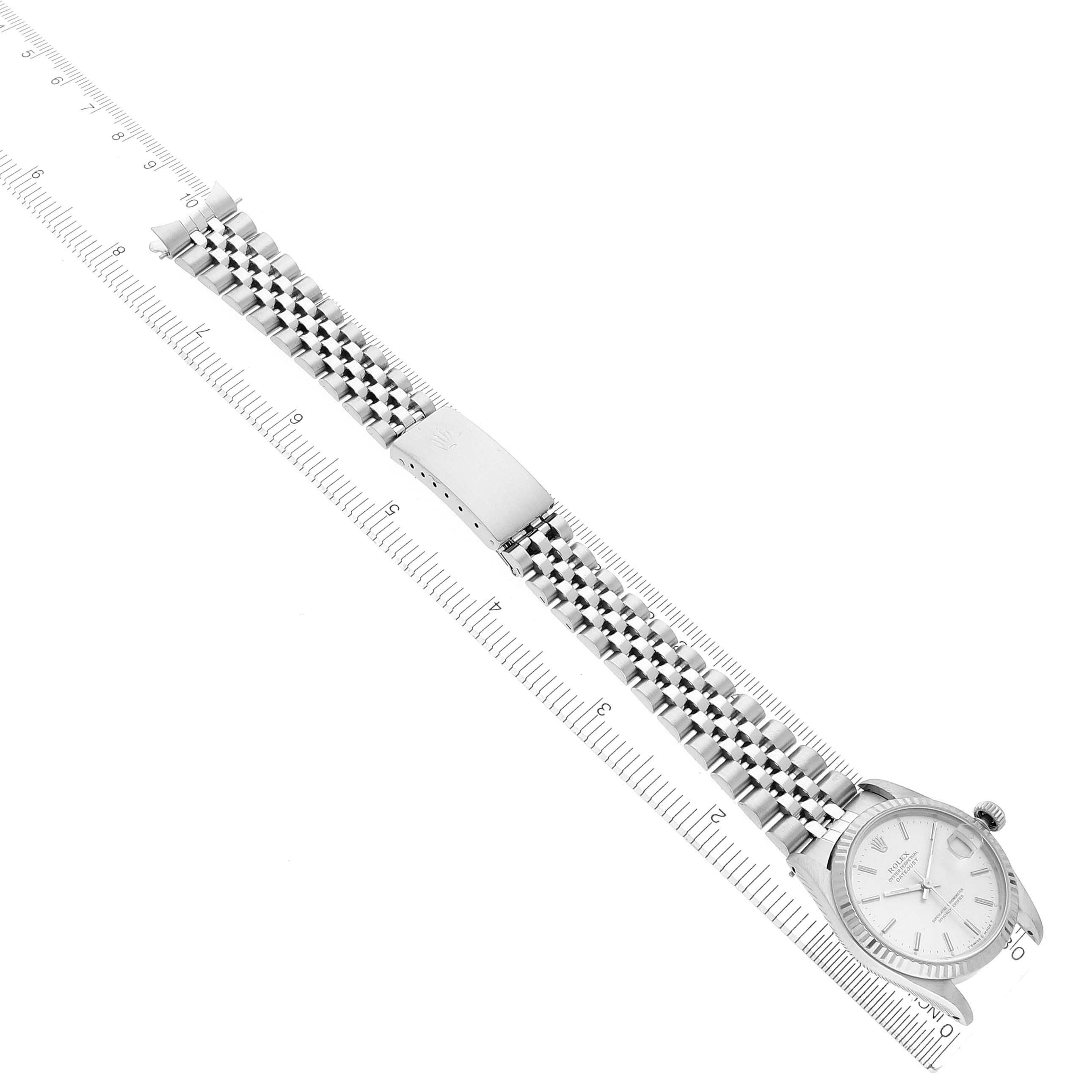 The image shows a Rolex Mid-Size 68274 Women's Stainless Steel Silver Dial 68274 Women's Stainless Steel Silver Dial model watch laid flat, highlighting the bracelet, clasp, and dial from a top-down angle.