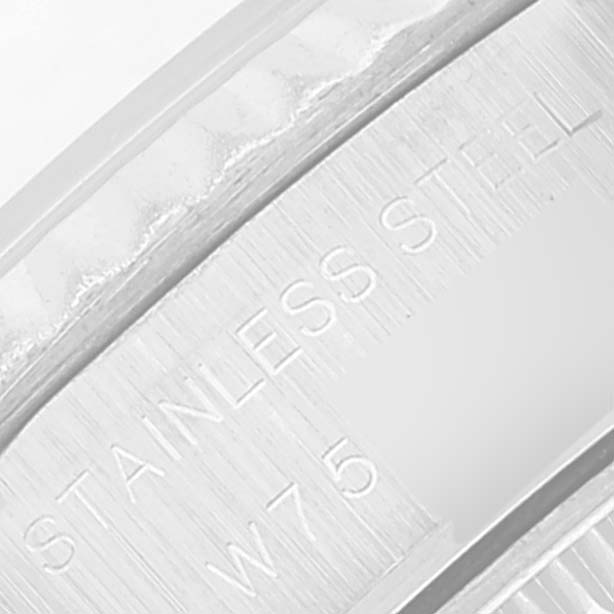 The image shows a close-up of the "Stainless Steel" engraving on the inner case of a Rolex Datejust 69174 Women's Stainless Steel Blue Dial 69174 Women's Stainless Steel Blue Dial watch.