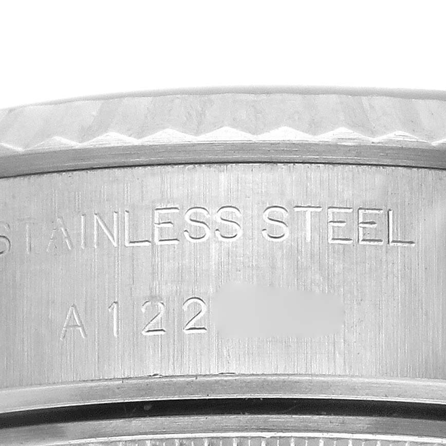 The image shows a close-up of the Rolex Datejust 69174 Women's Stainless Steel Pink Dial 69174 Women's Stainless Steel Pink Dial's side, highlighting the stainless steel engraving.