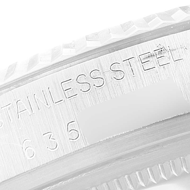 The image shows a close-up of the stainless steel case side with engravings on a Vintage Collection model by Rolex.