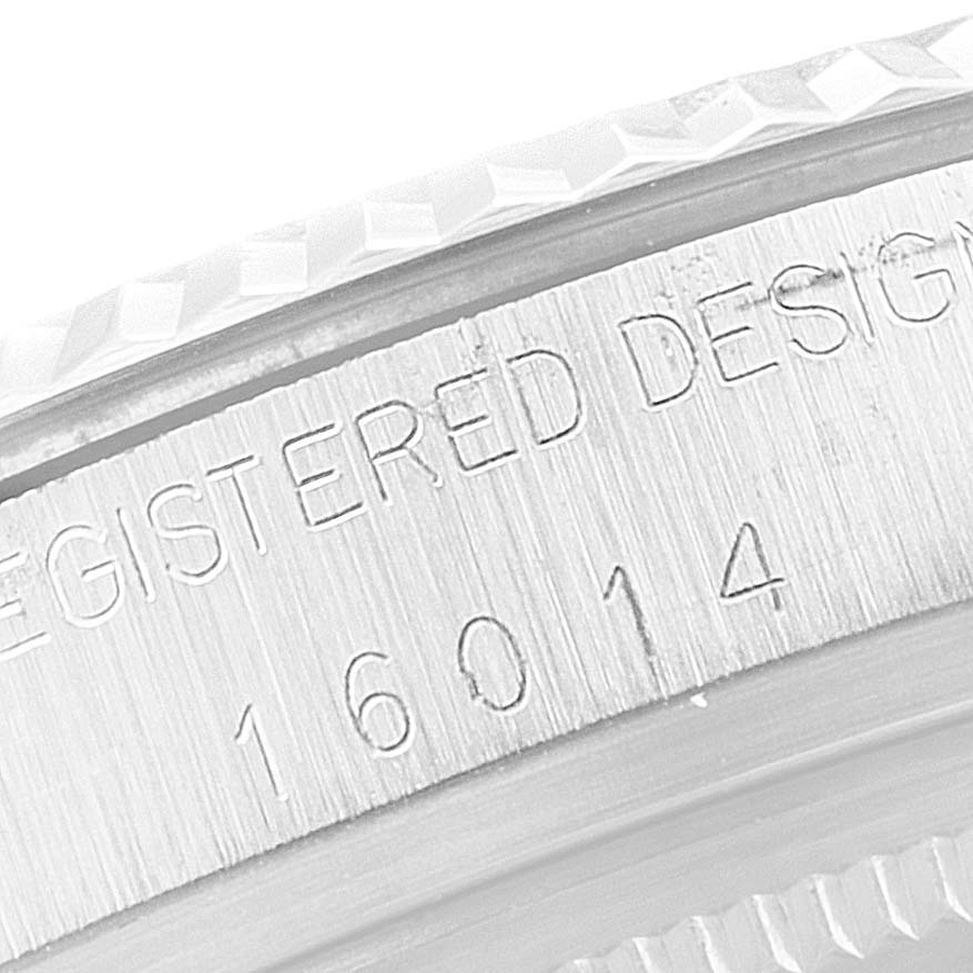 The image shows a close-up view of the side casing with engravings of the Rolex Vintage Collection 16014 Men's Stainless Steel Silver Dial 16014 Men's Stainless Steel Silver Dial watch model.