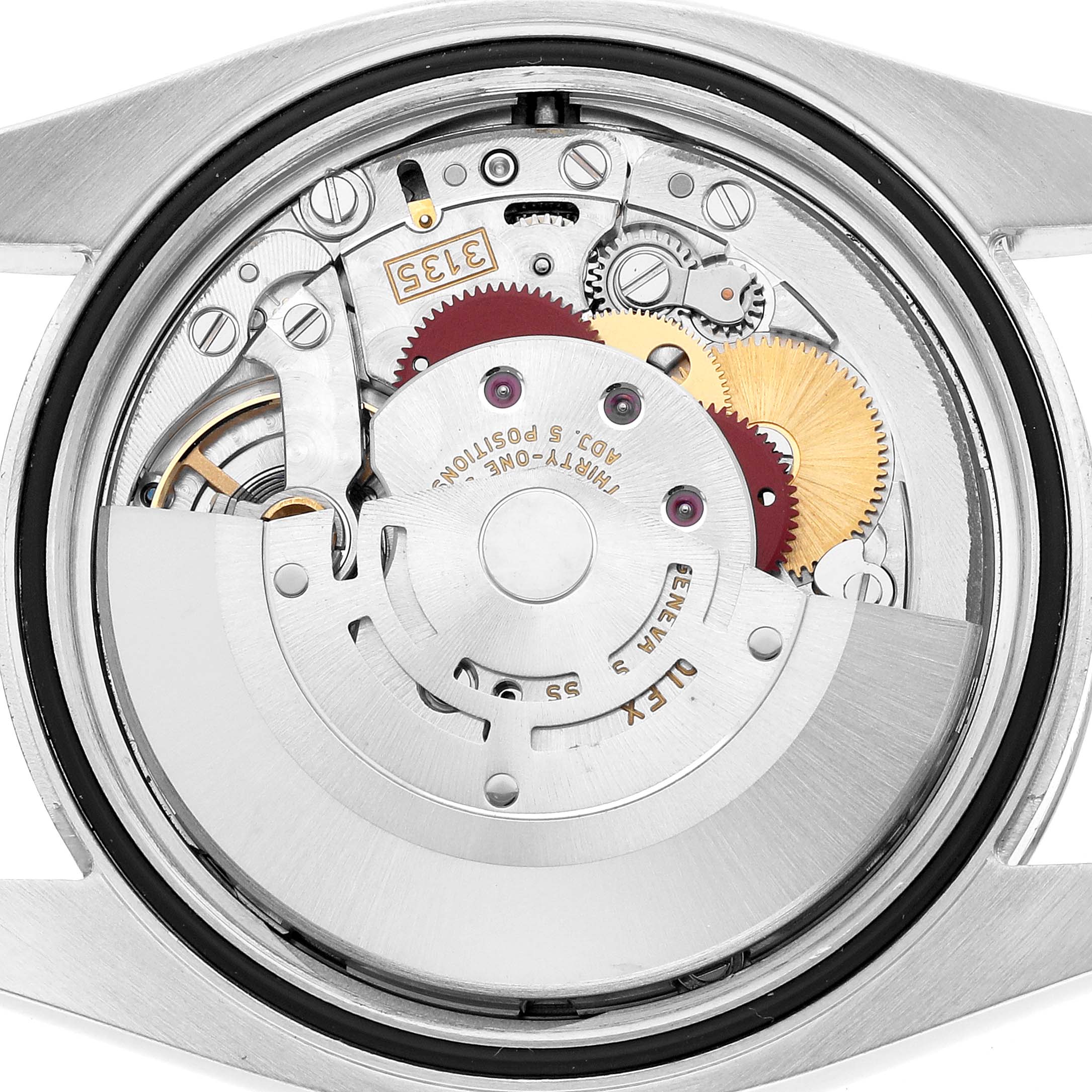 The image shows the internal movement mechanism of a Rolex Datejust 116200 Men's Stainless Steel White Dial watch from a back view, highlighting gears and components.