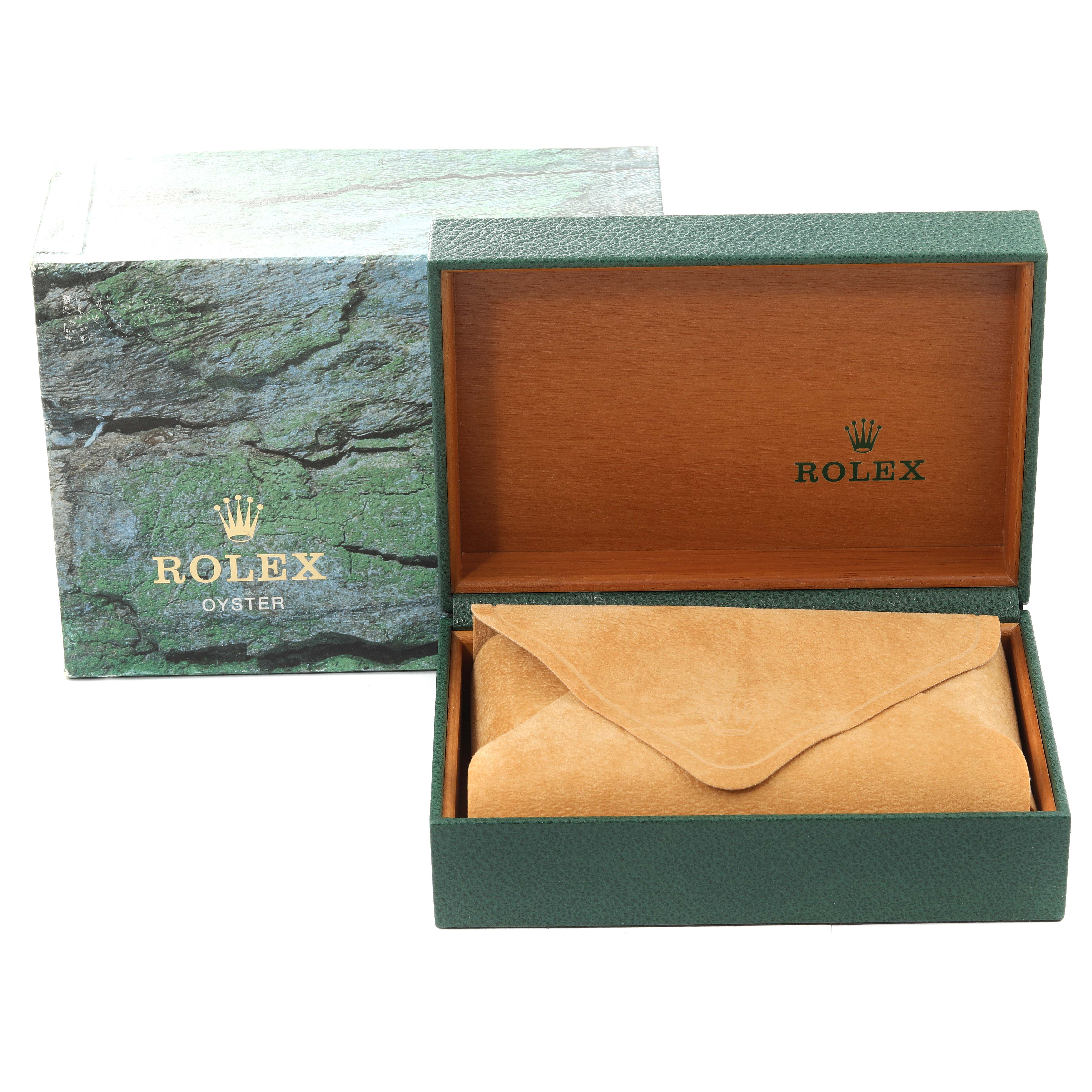 The image shows a Rolex Datejust 16233 Men's Steel and Gold (two tone) Blue Dial 16233 Men's Steel and Gold (two tone) Blue Dial watch box and packaging, including a green outer box and a green and wood interior box with a tan suede pouch.