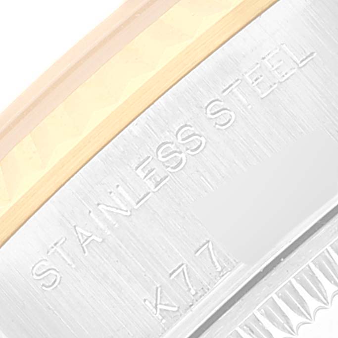The image shows a close-up of the side of a Datejust model Rolex watch, featuring the engraved words "STAINLESS STEEL."