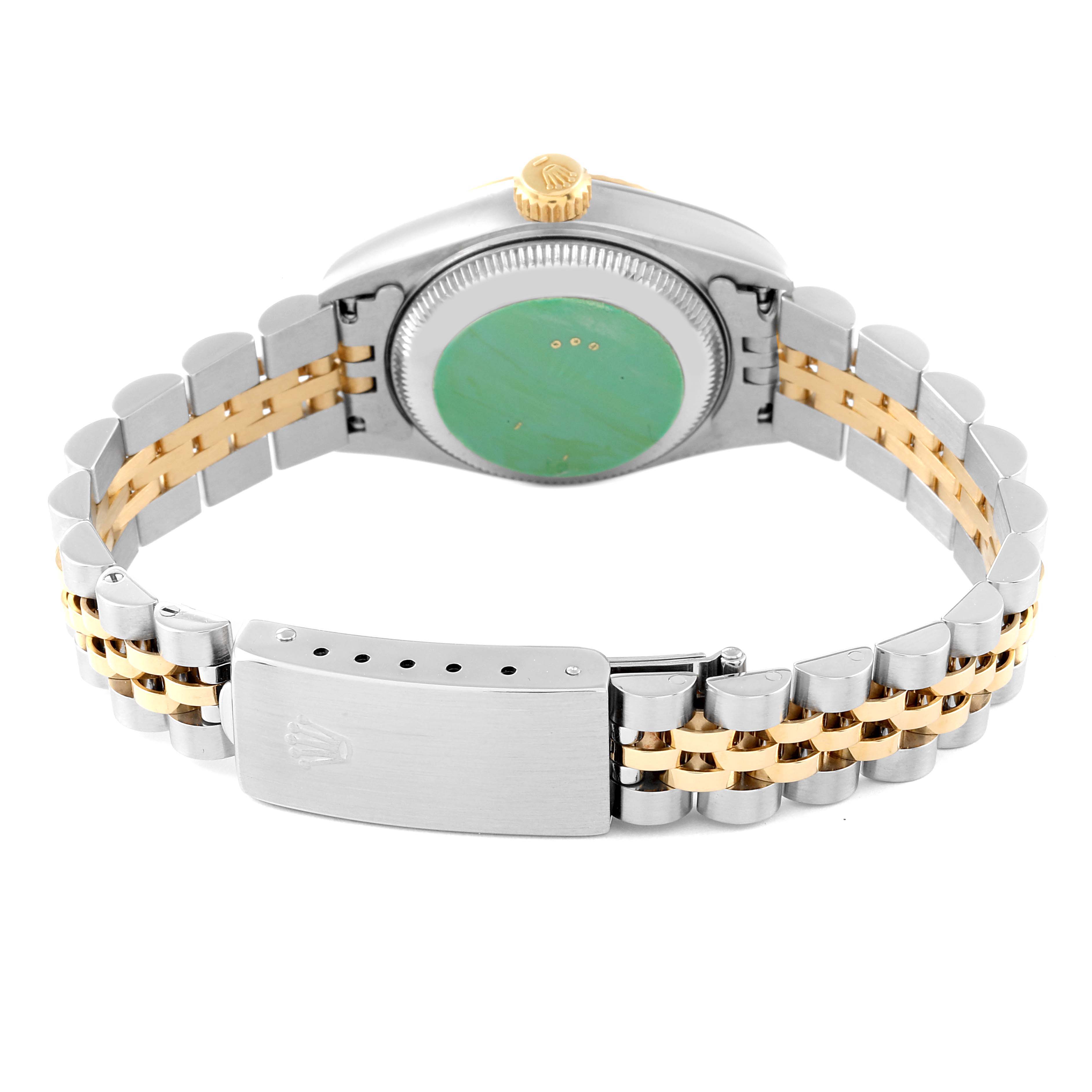 This image shows the back case, crown, and bracelet of a Rolex Datejust 69173 Women's Steel and Gold (two tone) Champagne Dial 69173 Women's Steel and Gold (two tone) Champagne Dial watch.
