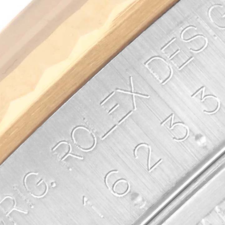 The image shows a close-up of the bezel and inner rim with engravings on the Rolex Datejust 16233 Men's Steel and Gold (two tone) Beige Dial 16233 Men's Steel and Gold (two tone) Beige Dial watch.