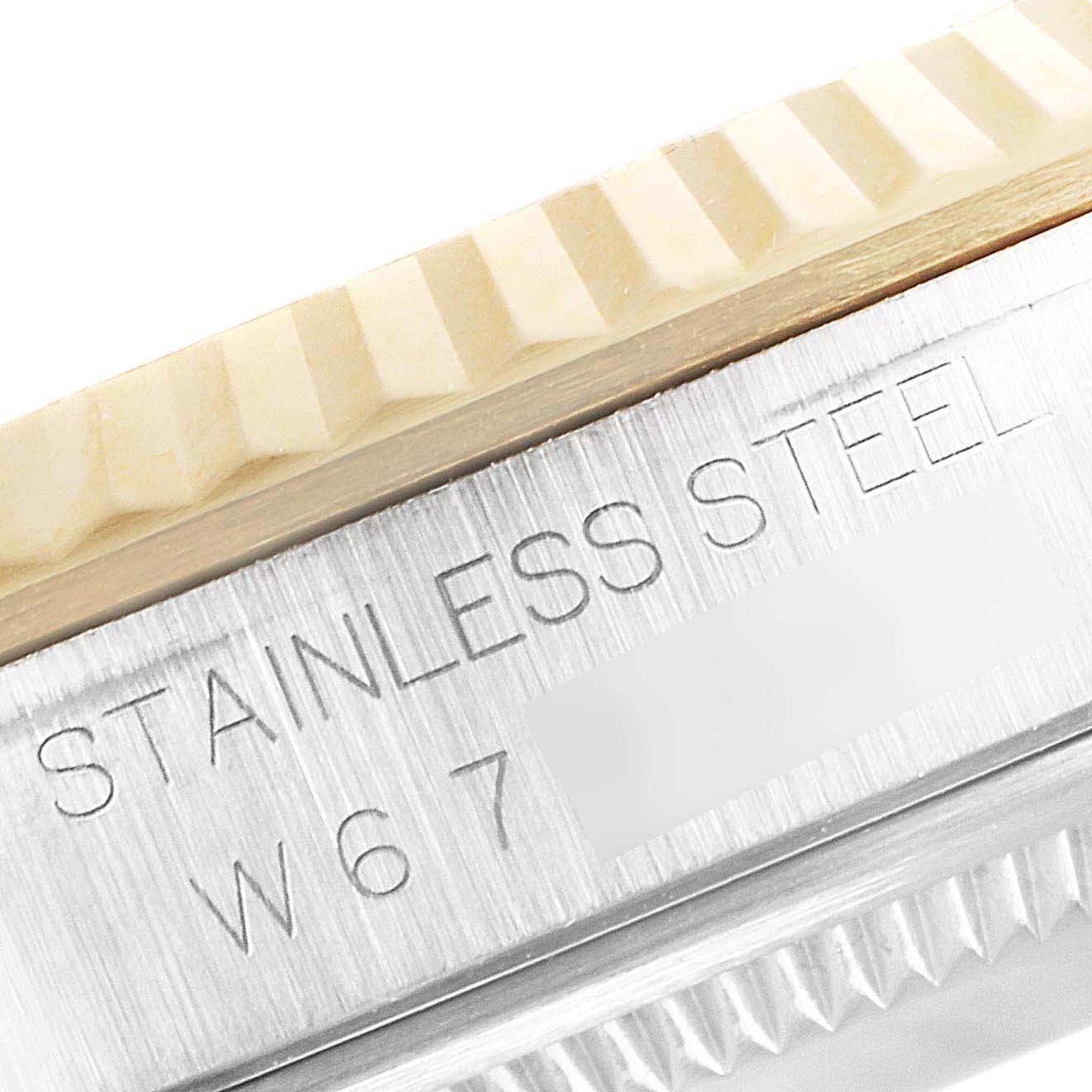 A close-up shot of the side of the Rolex Datejust 16233 Men's Steel and Gold (two tone) Champagne Dial 16233 Men's Steel and Gold (two tone) Champagne Dial watch, showing the stainless steel casing and part of the bezel.