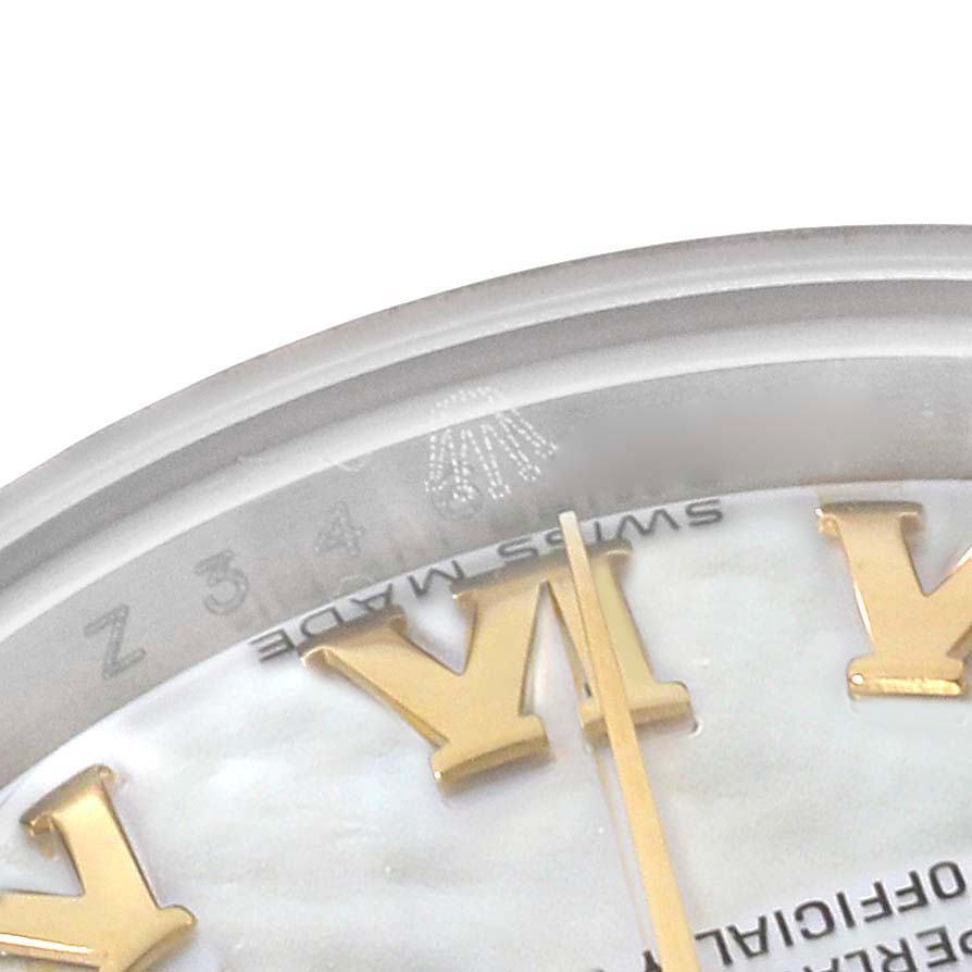 The image shows a close-up of the edge of the glass and part of the dial with "Swiss Made" of a Rolex Datejust 179173 Women's Steel and Gold (two tone) Mother of Pearl Dial 179173 Women's Steel and Gold (two tone) Mother of Pearl Dial watch.