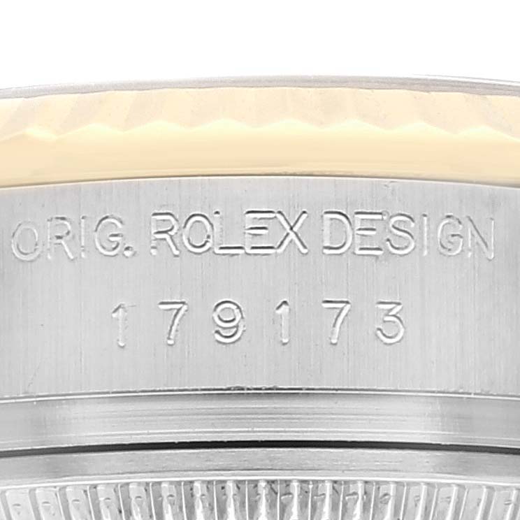 This close-up image shows the side engraving on the case of a Rolex Datejust 179173 Women's Steel and Gold (two tone) Mother of Pearl Dial 179173 Women's Steel and Gold (two tone) Mother of Pearl Dial model.