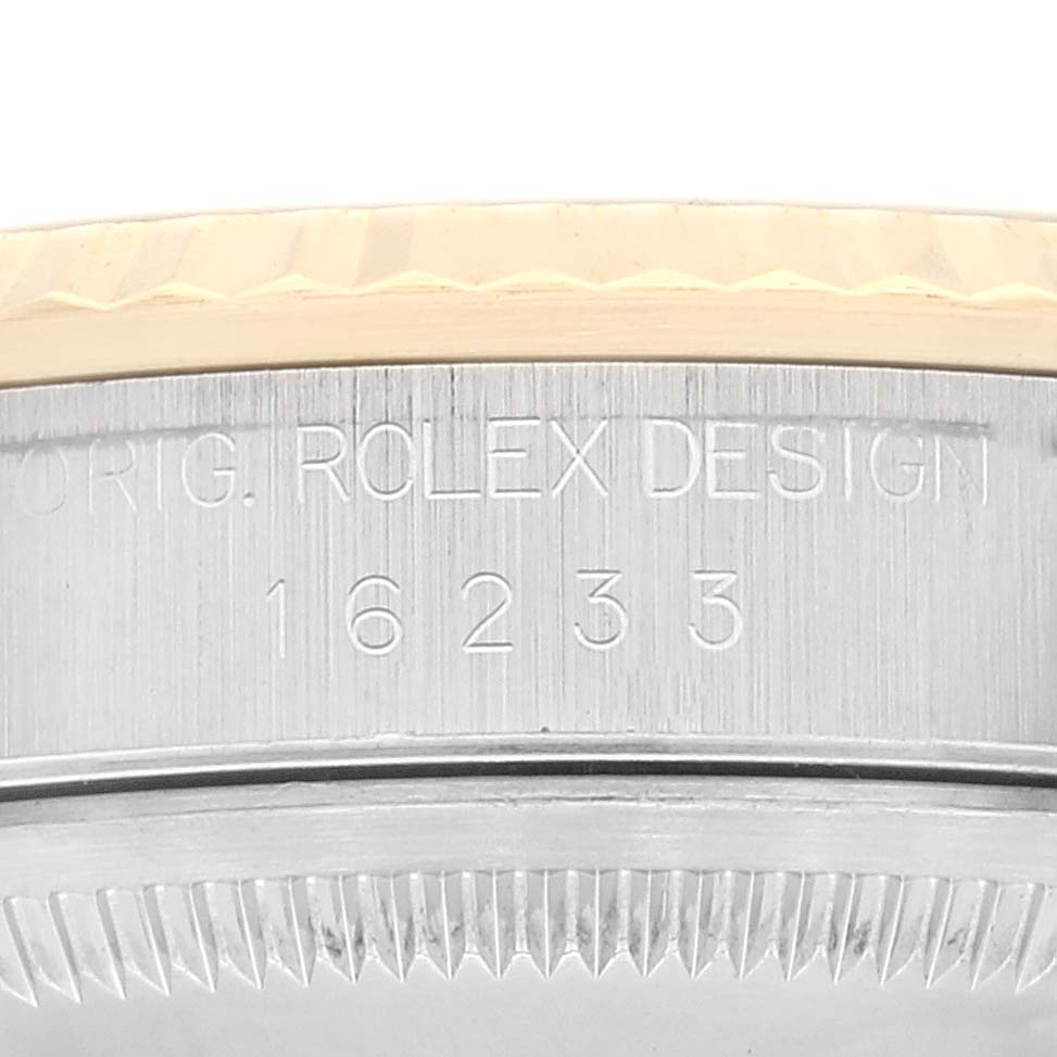 Close-up angle showing the side of the Rolex Datejust 16233 Men's Steel and Gold (two tone) White Dial 16233 Men's Steel and Gold (two tone) White Dial model with the engraving "ORIG. ROLEX DESIGN 16233".