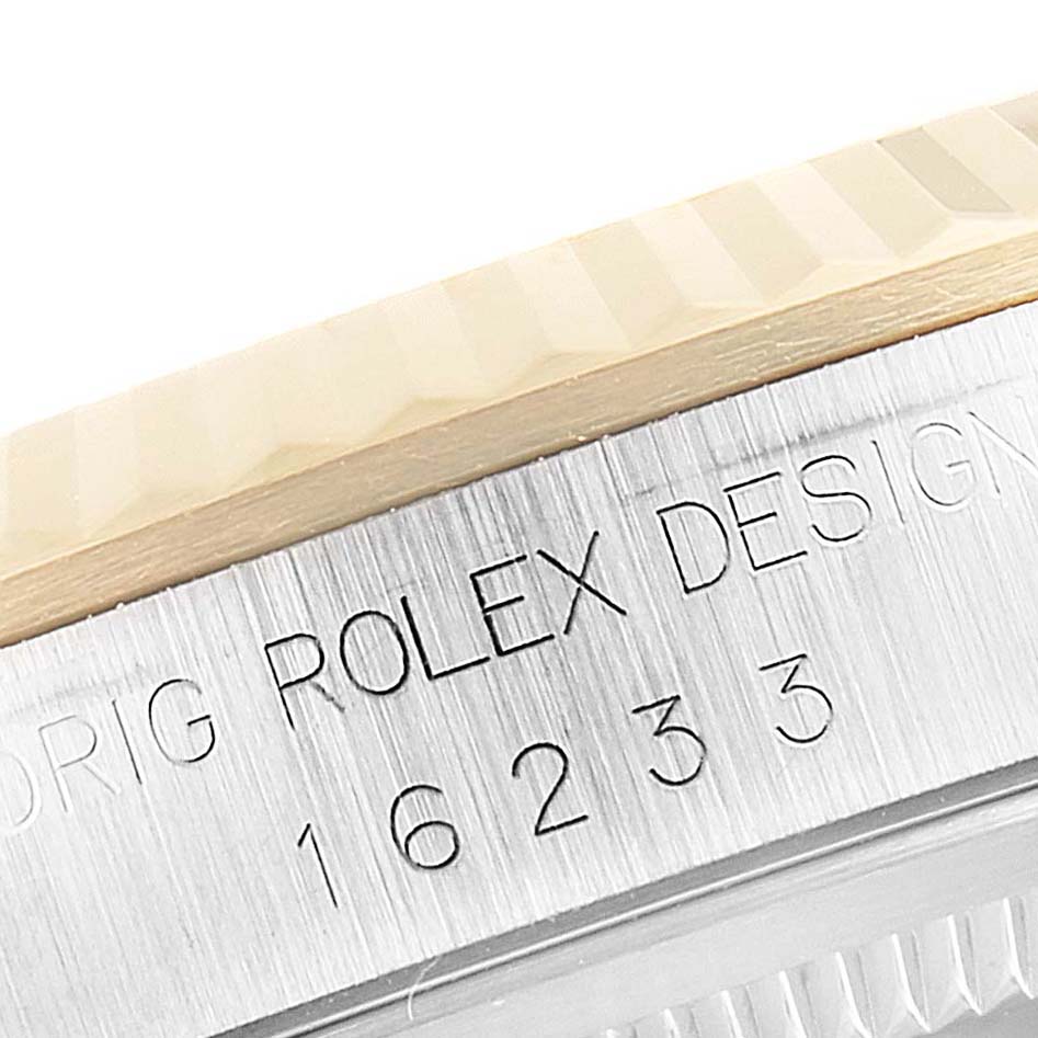 This close-up image of the Rolex Datejust 16233 Men's Steel and Gold (two tone) White Dial 16233 Men's Steel and Gold (two tone) White Dial model shows the side of the case with the engraving "Original Rolex Design 16233."