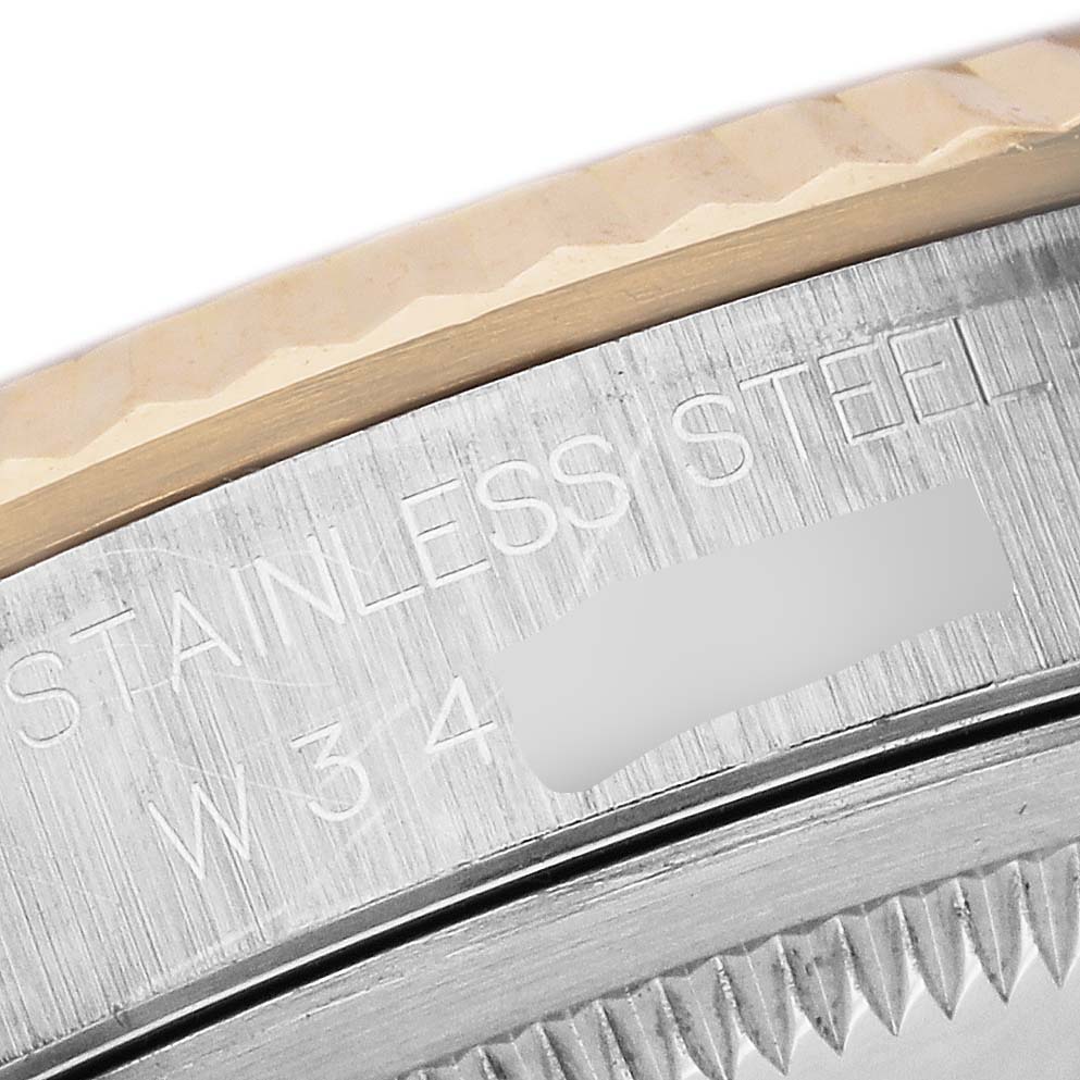 The image shows a close-up of the stainless steel case edge and bezel of a Rolex Datejust 16233 Men's Steel and Gold (two tone) White Dial 16233 Men's Steel and Gold (two tone) White Dial watch.